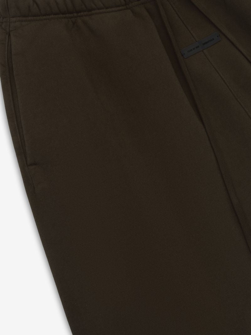 Close-up of olive Heavy Fleece Flare Sweatpant showing side pocket and waistband with subtle brand tag, gallery image 0 file 5B8-we7Q.jpg