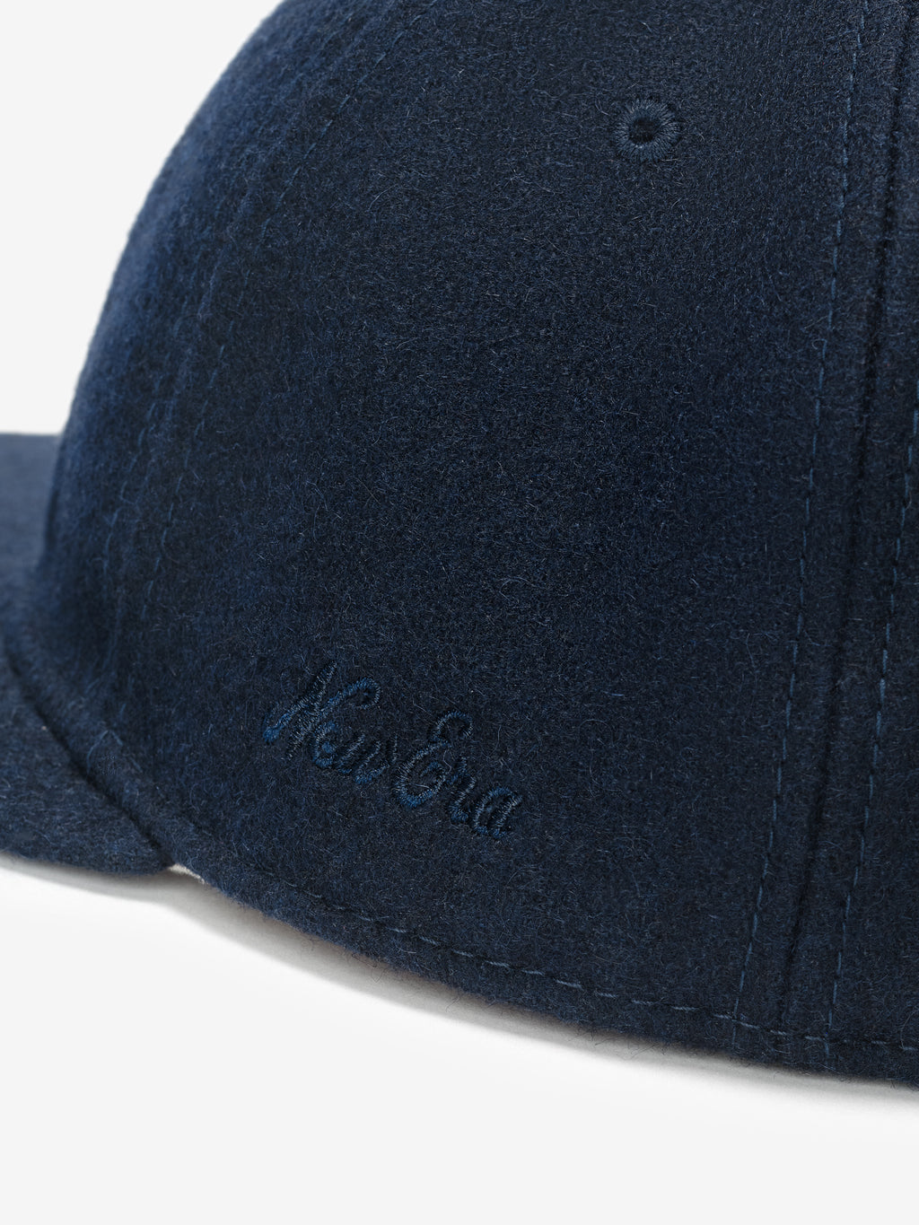 Fear of God Essentials 59FIFTY Retro Fitted National League Cap in deep navy wool blend showcasing detailed side embroidery with a soft textured fabric and structured panels.