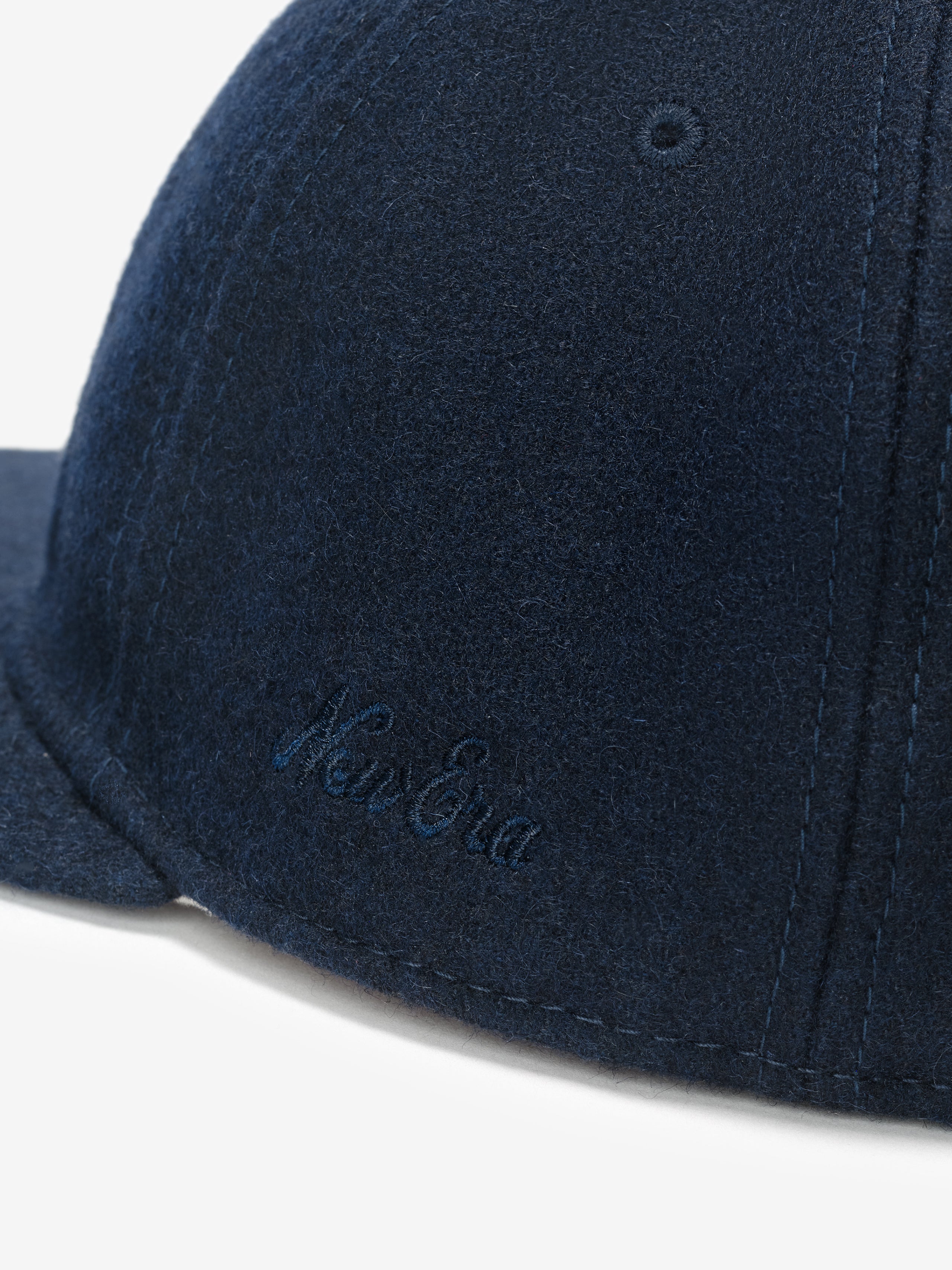 Fear of God Essentials 59FIFTY Retro Fitted National League Cap in deep navy wool blend showcasing detailed side embroidery with a soft textured fabric and structured panels.