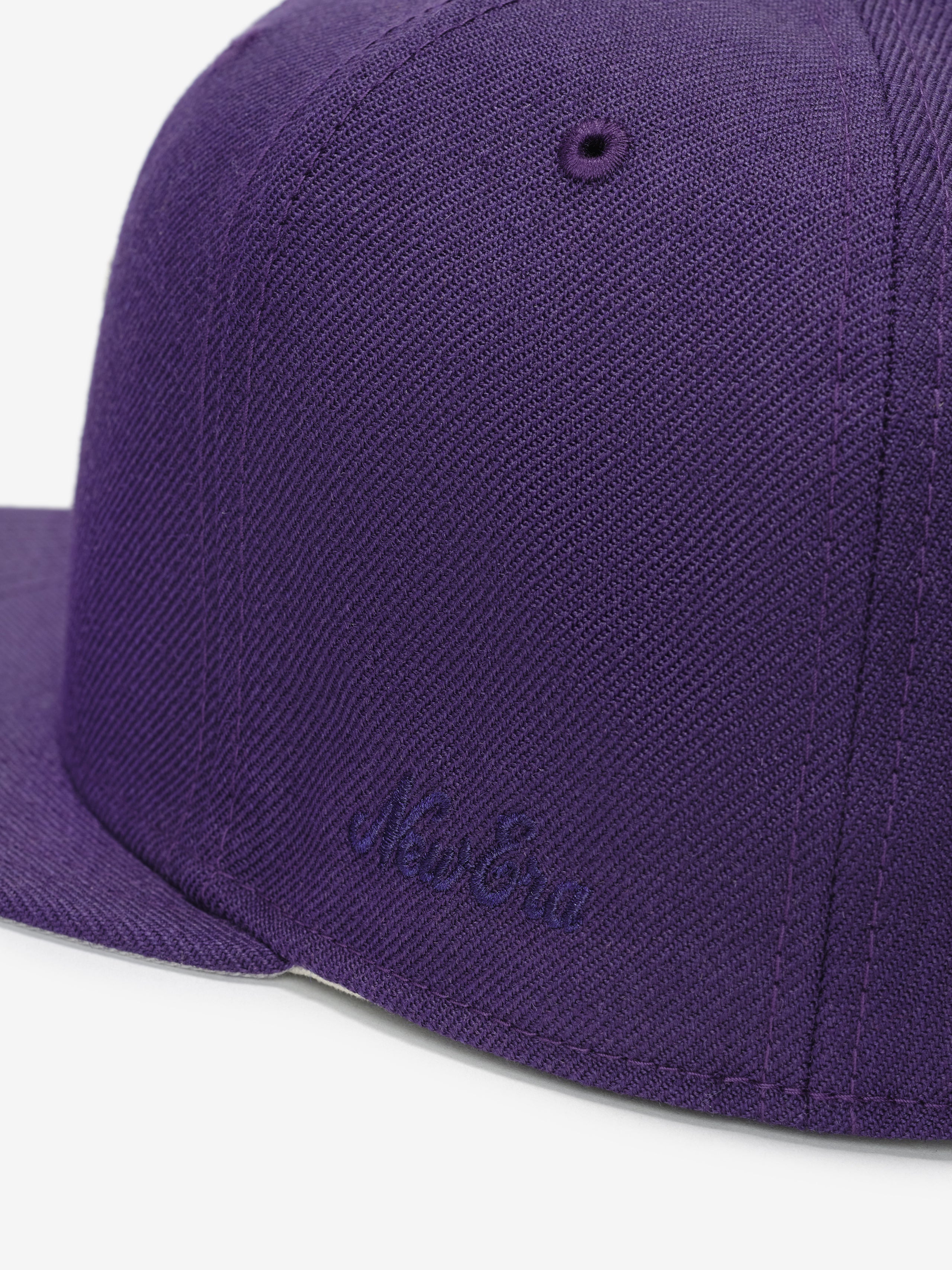 Colorado Rockies 59FIFTY Cap in deep purple showcasing a close-up of the textured fabric and tonal embroidered New Era logo on the structured side panel.