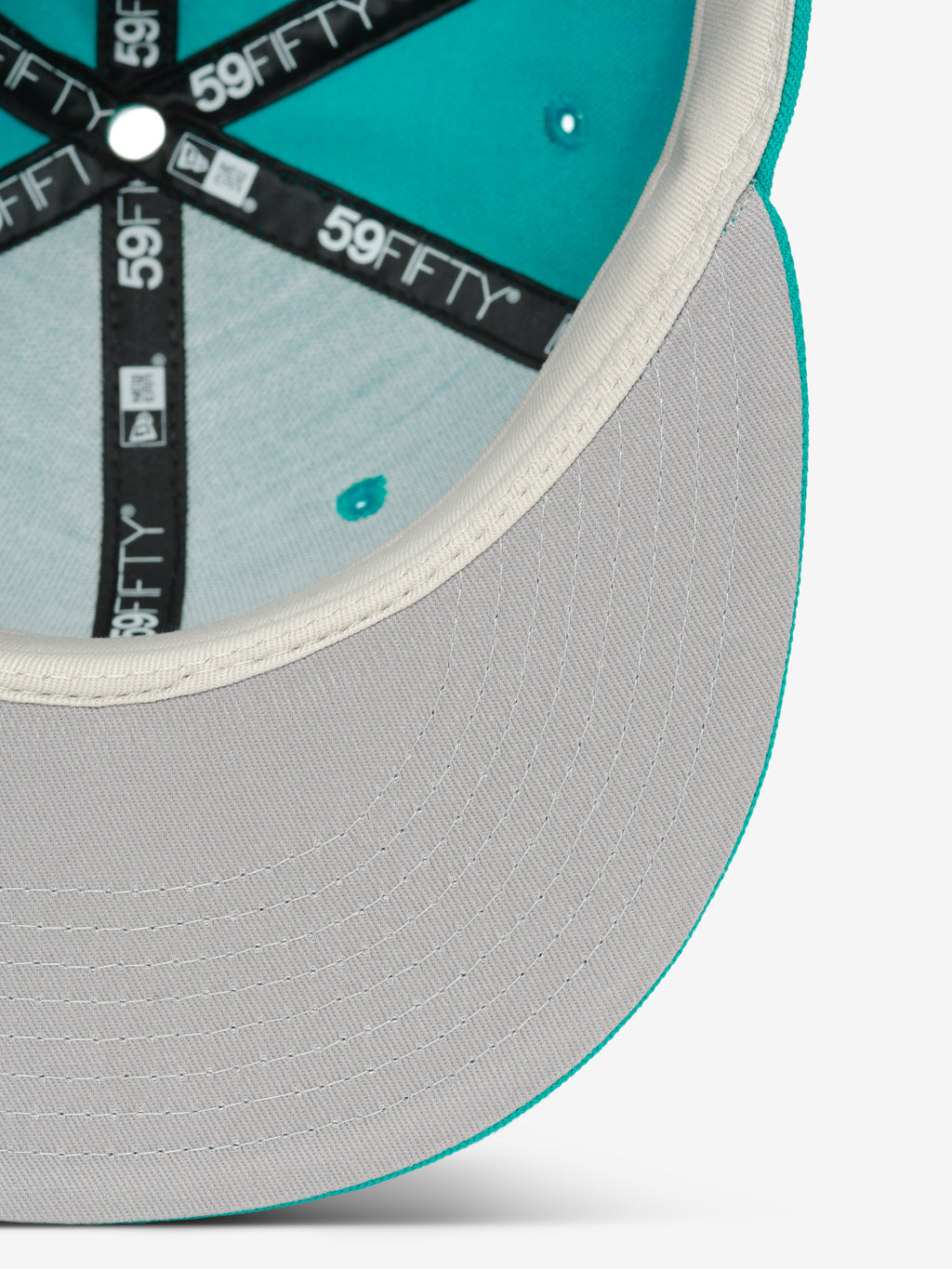 Miami Marlins 59FIFTY Cap showing the inside view with a light grey underbill, white inner trim, and black branded taping along the structured teal panels.