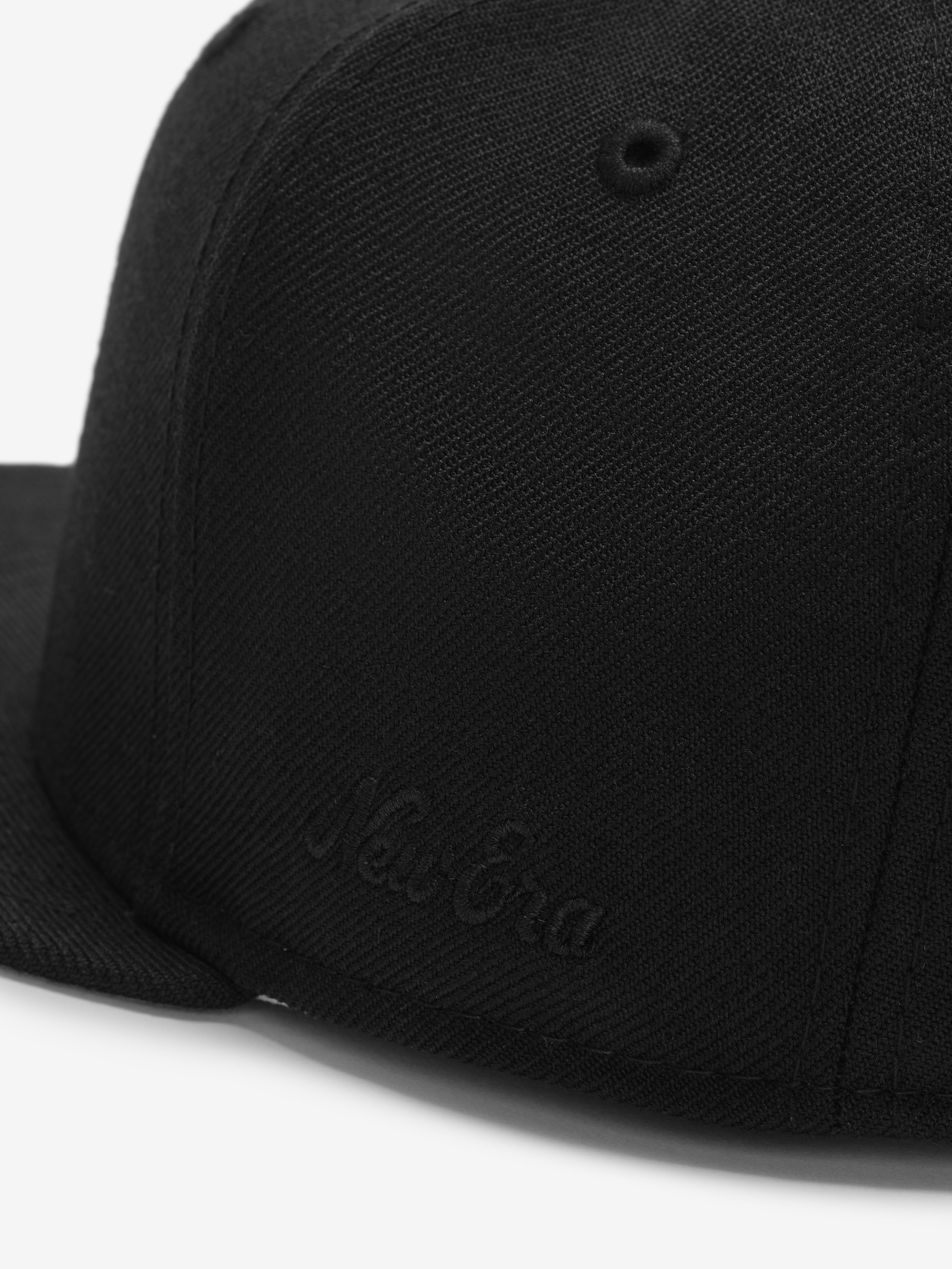 Chicago White Sox 59FIFTY Cap in black showing a close-up of the front panel with tonal embroidered New Era branding and detailed textured fabric.