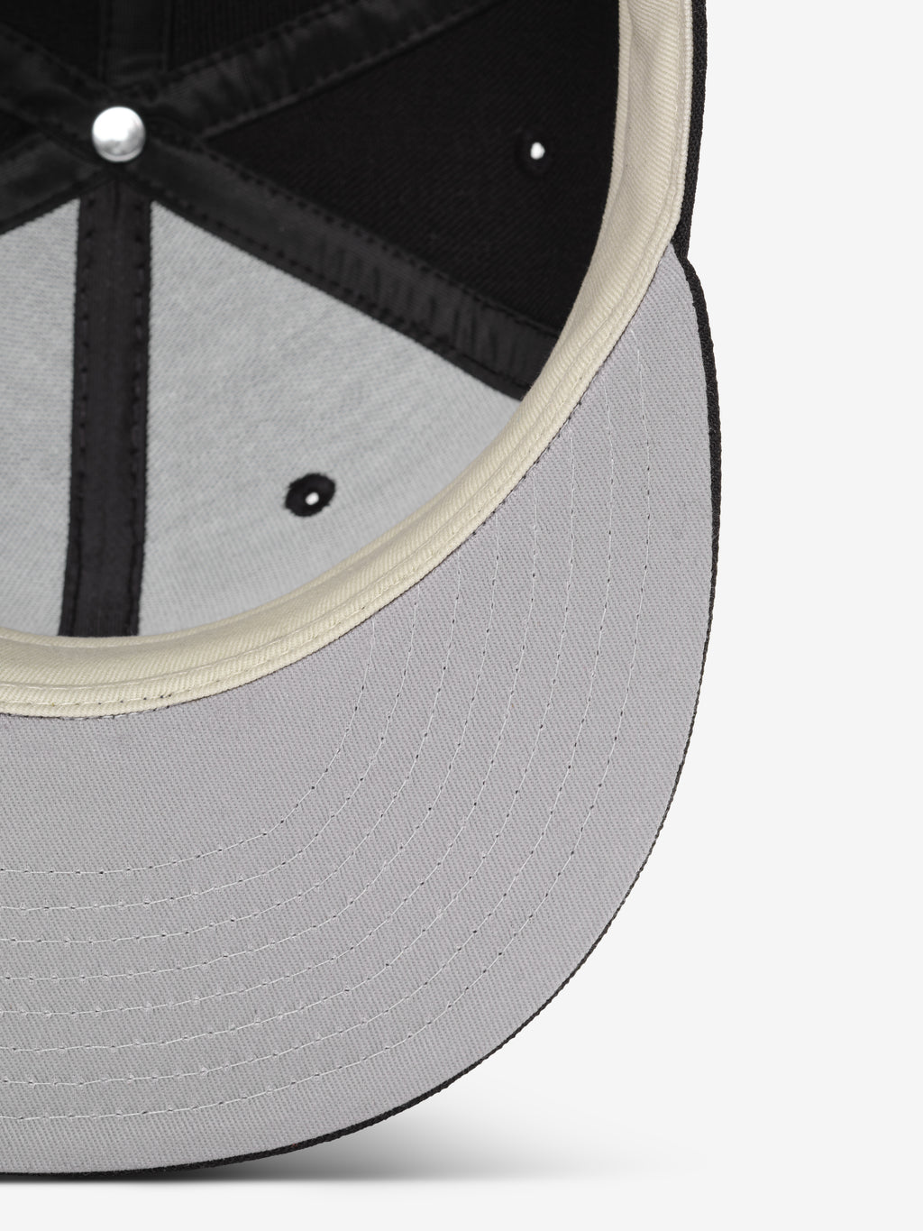 Chicago White Sox 59FIFTY Cap showing the underside of the brim in light grey with detailed stitching and the interior black paneling accented by contrasting off-white sweatband.