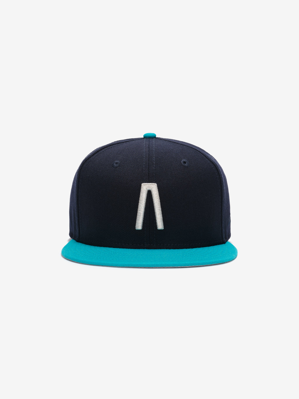 Fear of God Essentials 59FIFTY Athletics Cap in navy with a contrasting turquoise flat brim, featuring a raised white embroidered minimalist logo on the front panel.