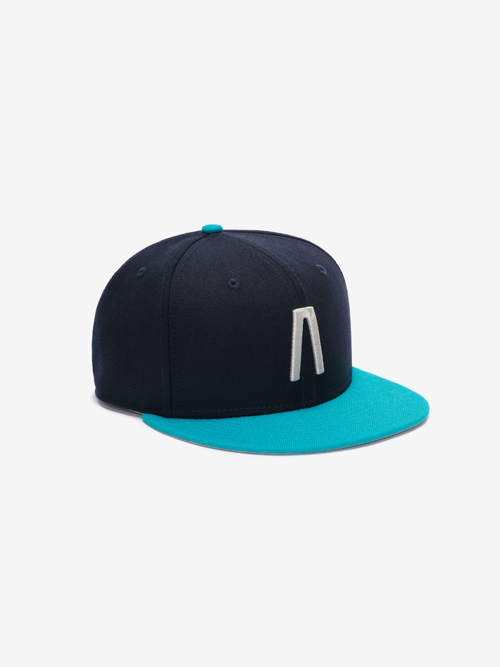 Fear of God Essentials 59FIFTY Athletics Cap in deep navy with a contrasting bright turquoise flat brim, featuring a raised white embroidered minimalistic logo on the front panel.