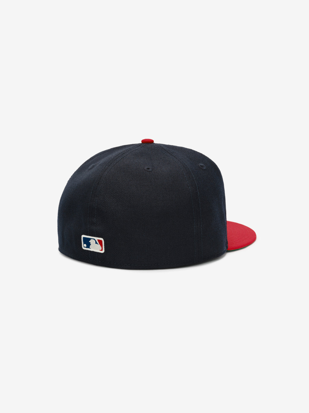 Fear of God Essentials 59FIFTY Athletics Cap shown from the rear, featuring a deep navy crown with a contrasting vibrant red flat brim, red top button, and a small MLB logo embroidered near the base.