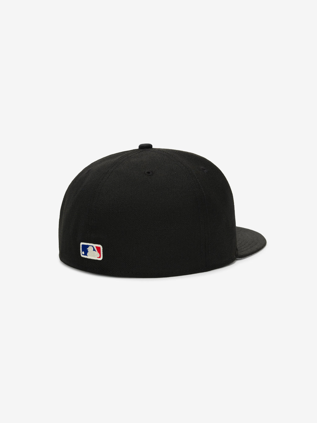 Fear of God Essentials 59FIFTY Athletics Cap shown from the back, featuring a solid black crown with tonal black stitching, a matching flat brim, and a small MLB logo embroidered near the base.