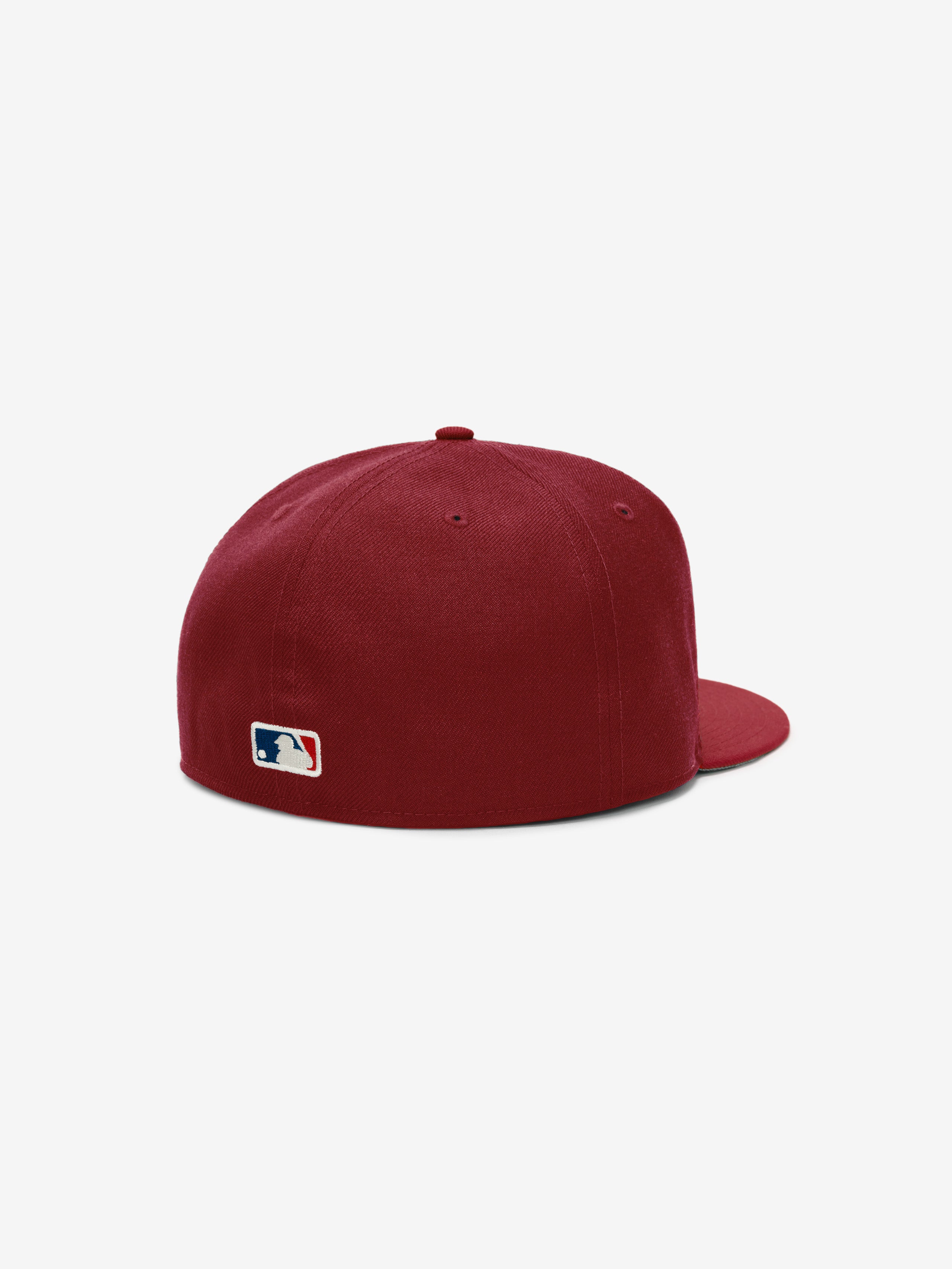 Rear view of Fear of God Essentials 59FIFTY Athletics Cap in deep crimson featuring a structured fit, flat brim, stitched ventilation eyelets, and stitched MLB logo on the back panel.