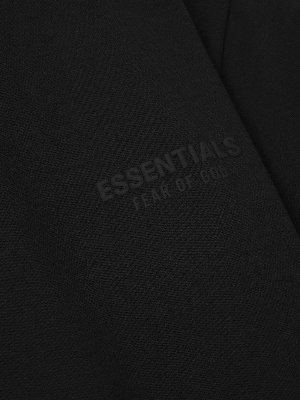 Black fabric with 'essentials Fear of God' puff print logo