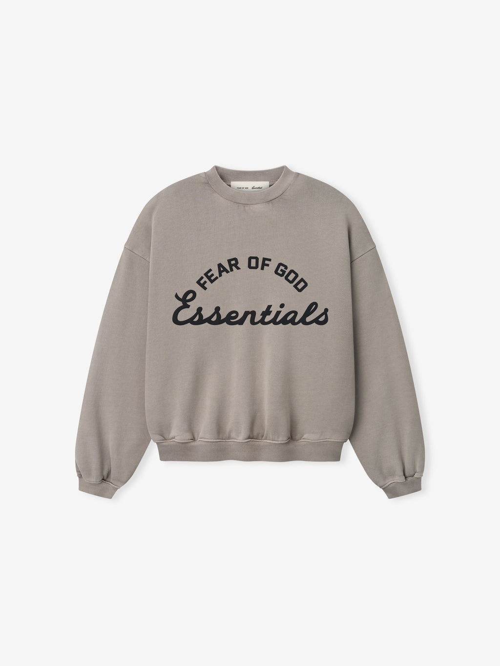 Light brown crewneck sweatshirt with black "Fear of God Essentials" text in curved and script fonts on front center