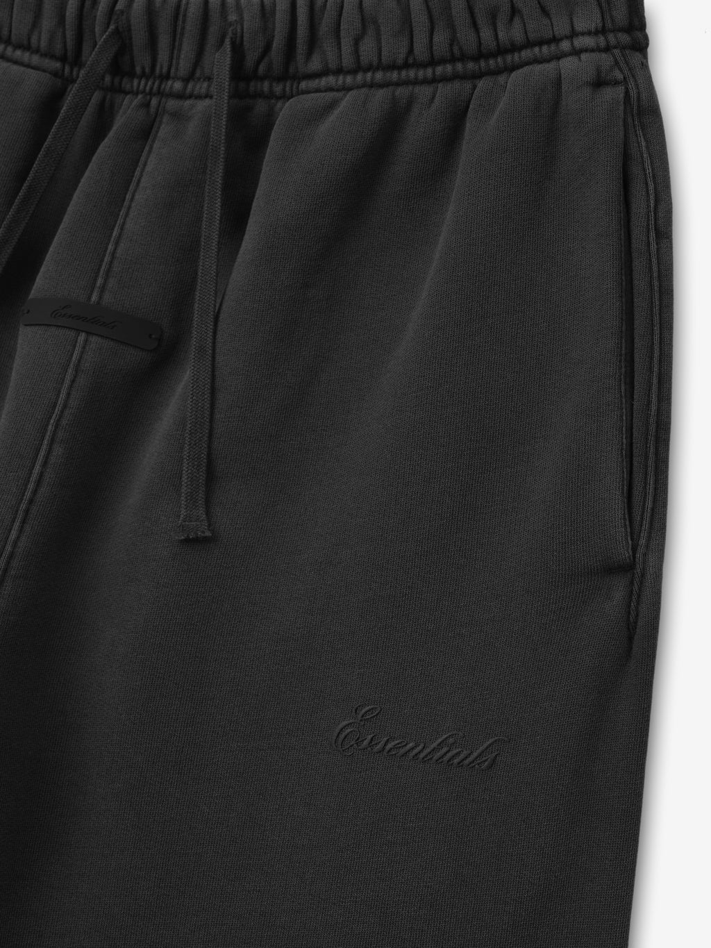 black kids flare sweatpant with elastic waistband, drawstring, side pockets, and tonal Essentials logo embroidery