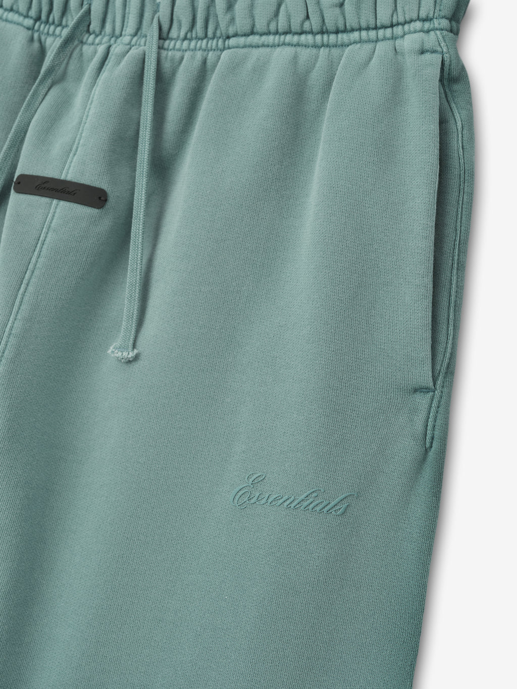 muted teal kids flare sweatpant in heavyweight cotton fleece with embossed Essentials logo and drawstring waistband
