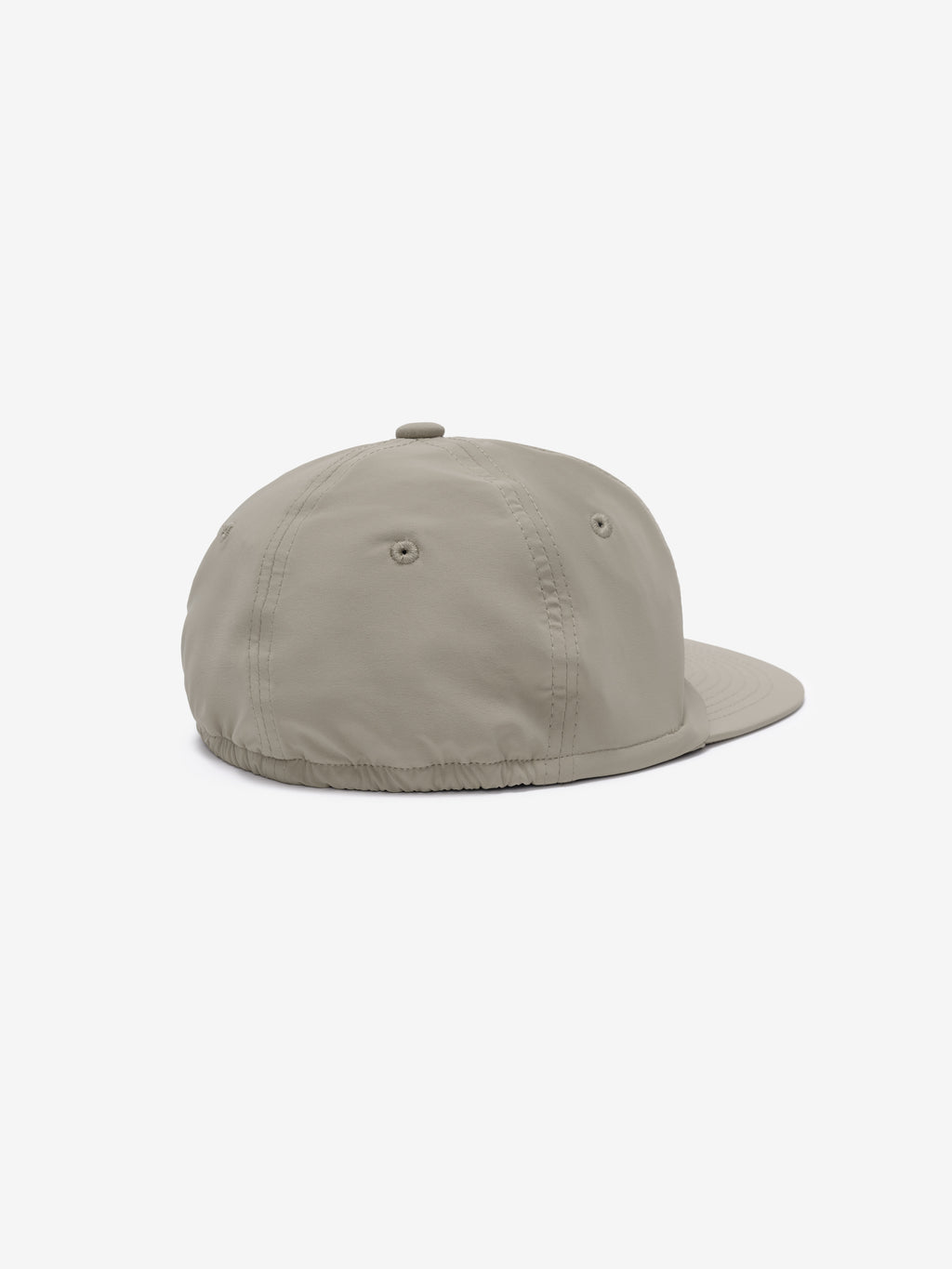 5 Panel Nylon Hat in a soft beige tone with subtle stitched eyelets and an elasticated back for a comfortable, secure fit and minimalist casual style.