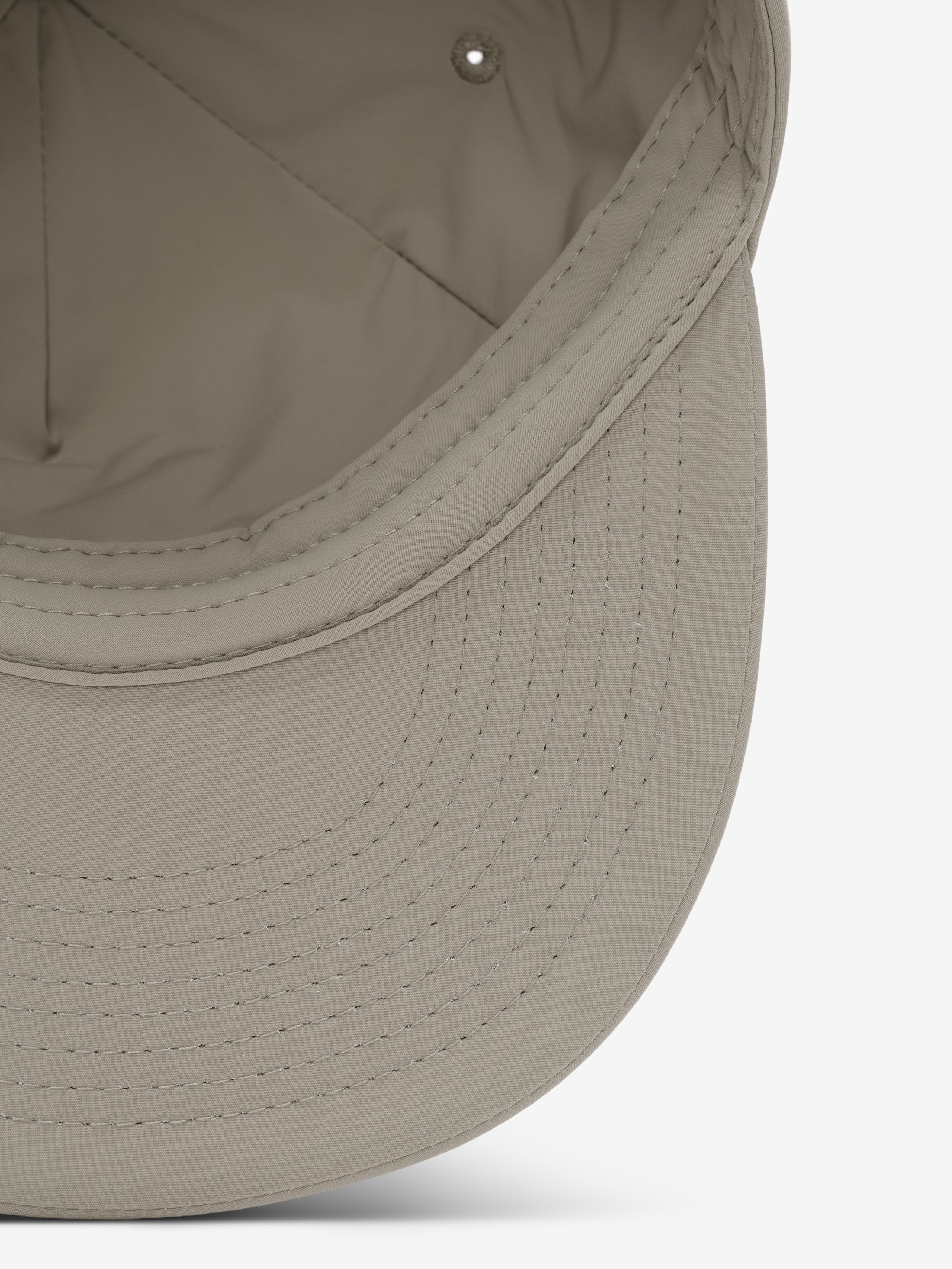 5 Panel Nylon Hat in a soft neutral shade with detailed topstitching on the curved brim and a smooth interior lining for lightweight, comfortable casual wear.