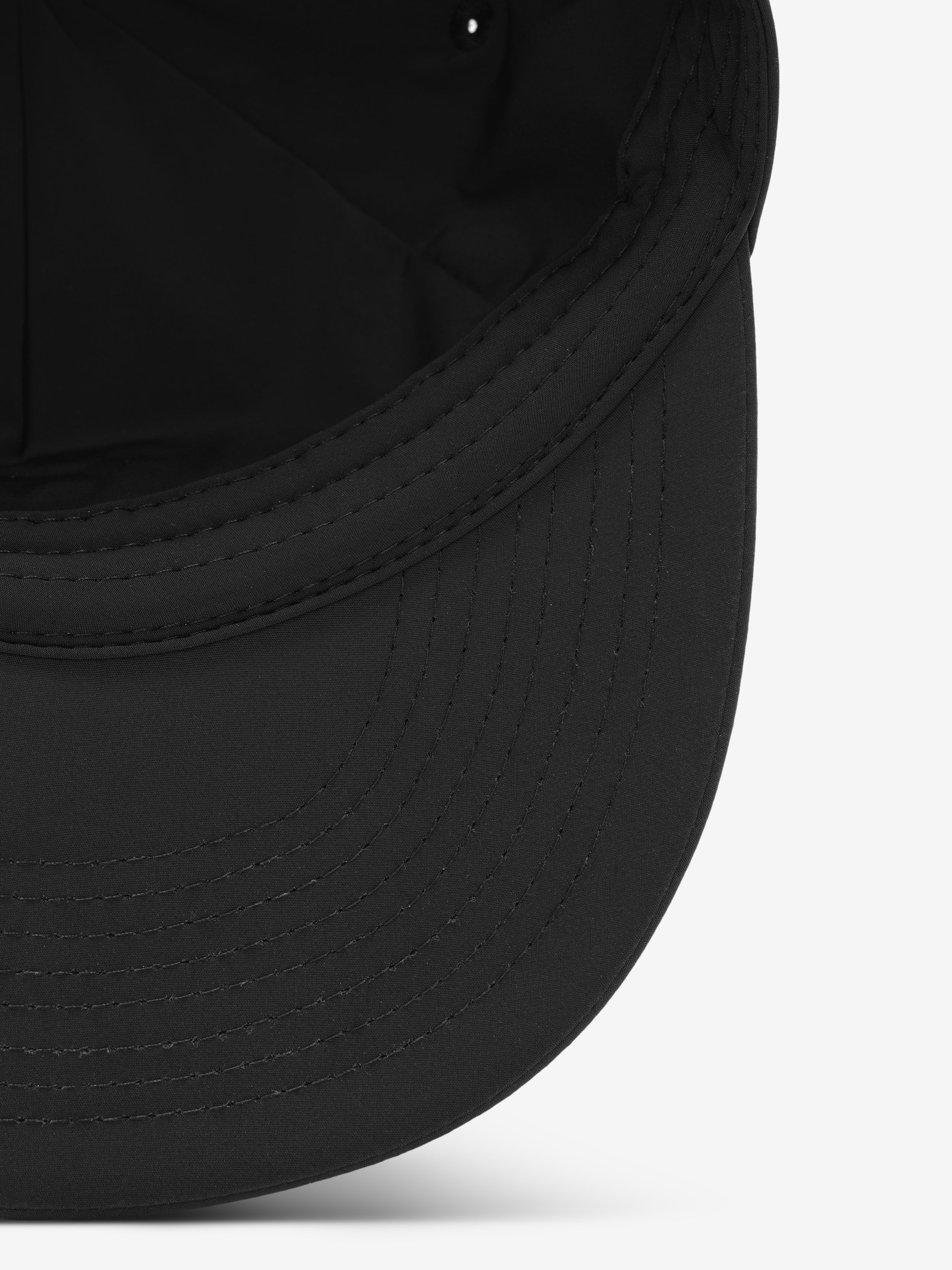 5 Panel Nylon Hat in classic black with a smooth, lightweight nylon brim featuring precise topstitching for a clean, refined look in casual headwear.