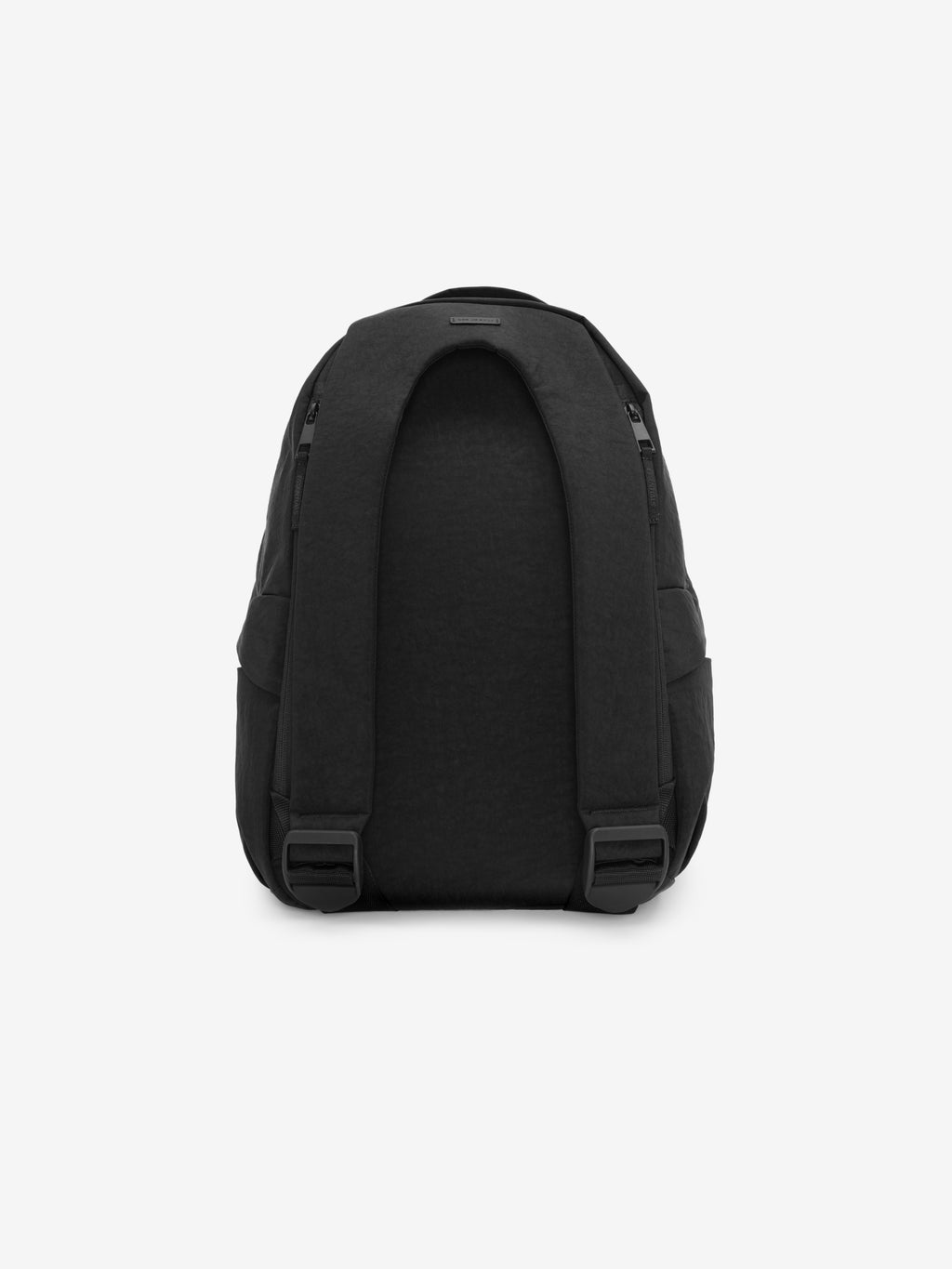 Essentials Backpack in black shown from the back with a padded contoured rear panel adjustable shoulder straps and secure buckles against a plain light background