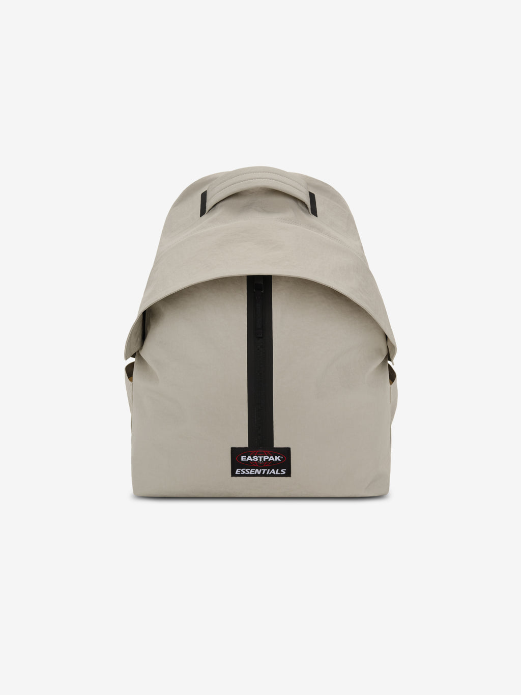 Essentials Backpack in beige shown from the front with a top carry handle central black zipper and rectangular logo patch on a clean white background