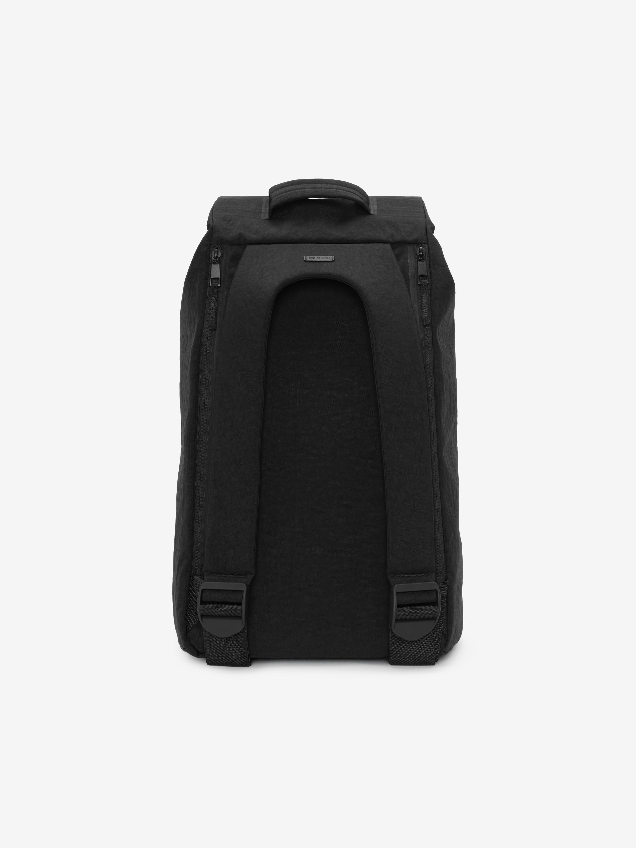 Sports Duffel in black viewed from the back showing padded shoulder straps adjustable buckles a top carry handle and a compact structured shape on a white background