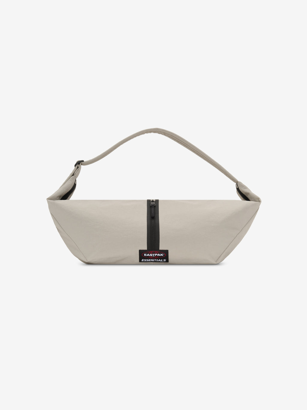 Essentials Shell Bag in light beige with a curved shoulder strap central black zipper and small woven label displayed against a clean white background