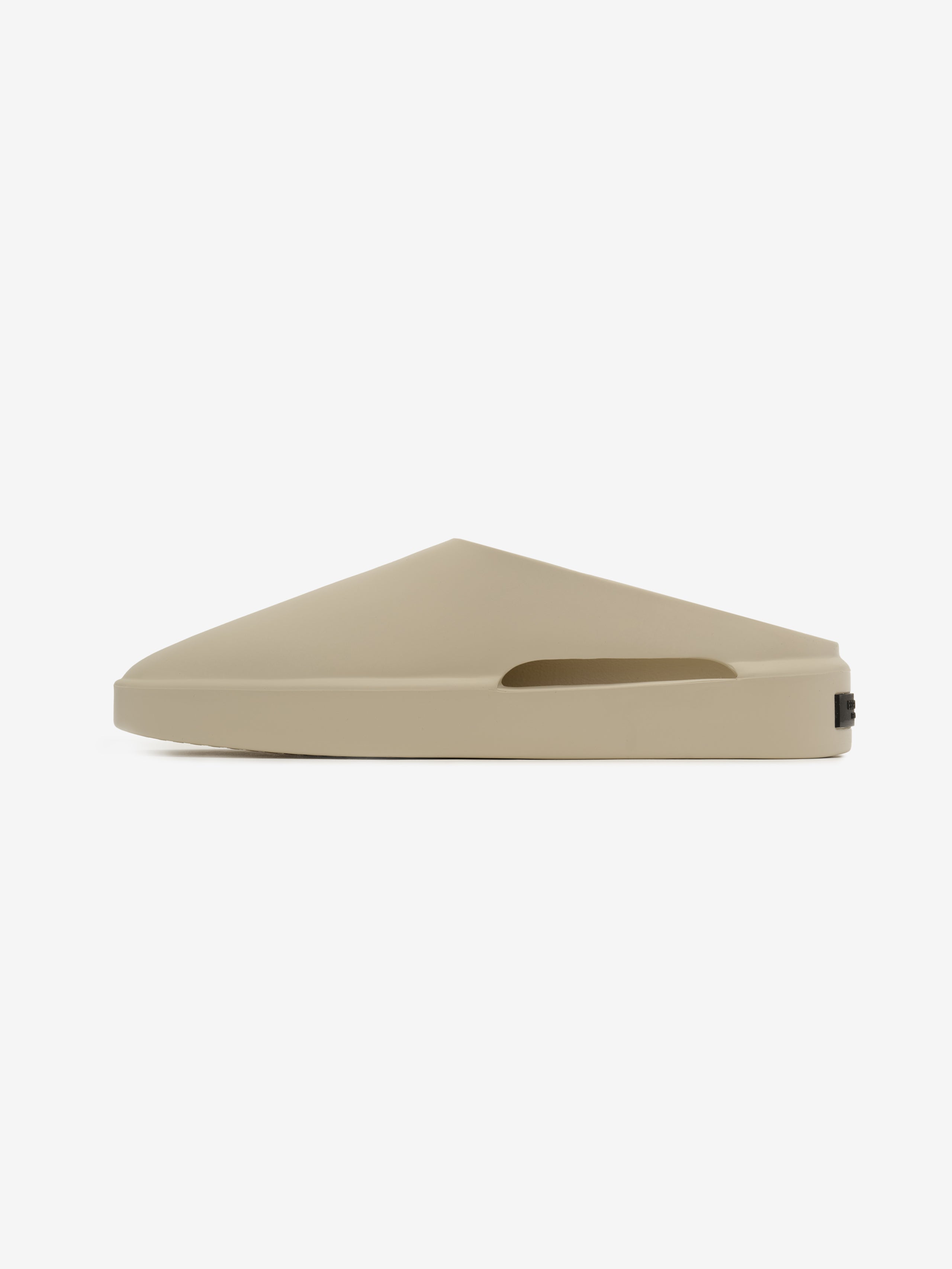 Essentials California 1.0 slip-on footwear in a neutral beige shade, featuring a sleek, streamlined profile with a modern, minimalist sculpted design for casual comfort.