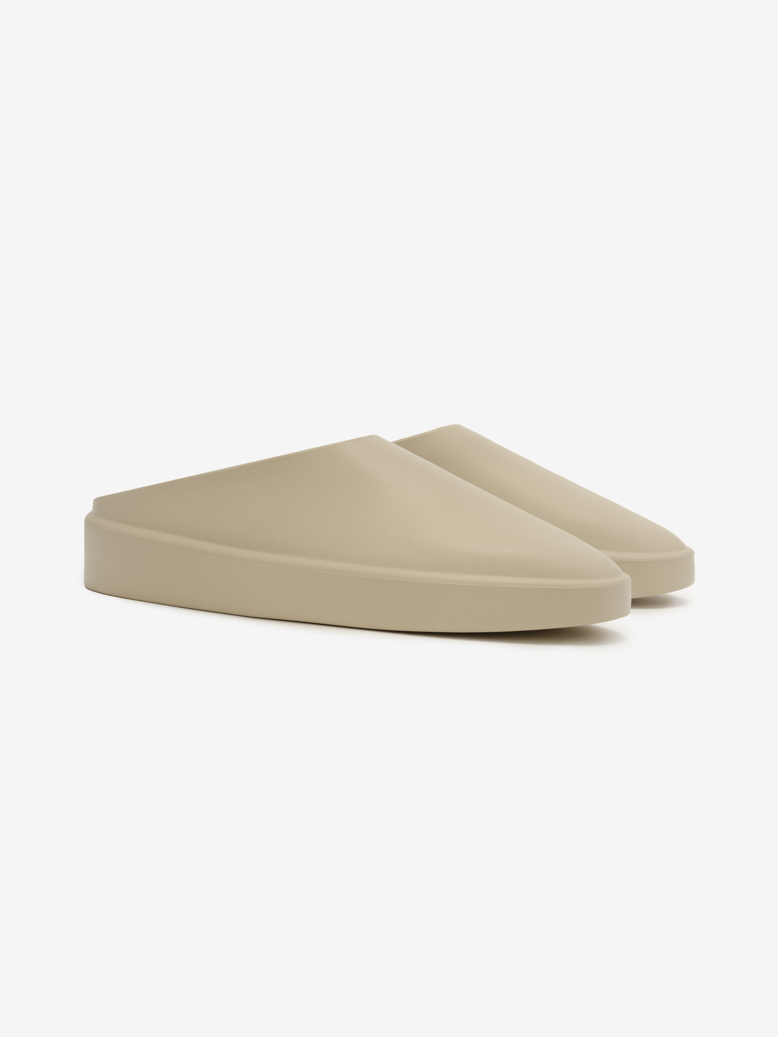 Essentials California 1.0 slip-on footwear in a soft beige tone, featuring a smooth, minimalist design with a clean silhouette for modern, comfortable casual wear.