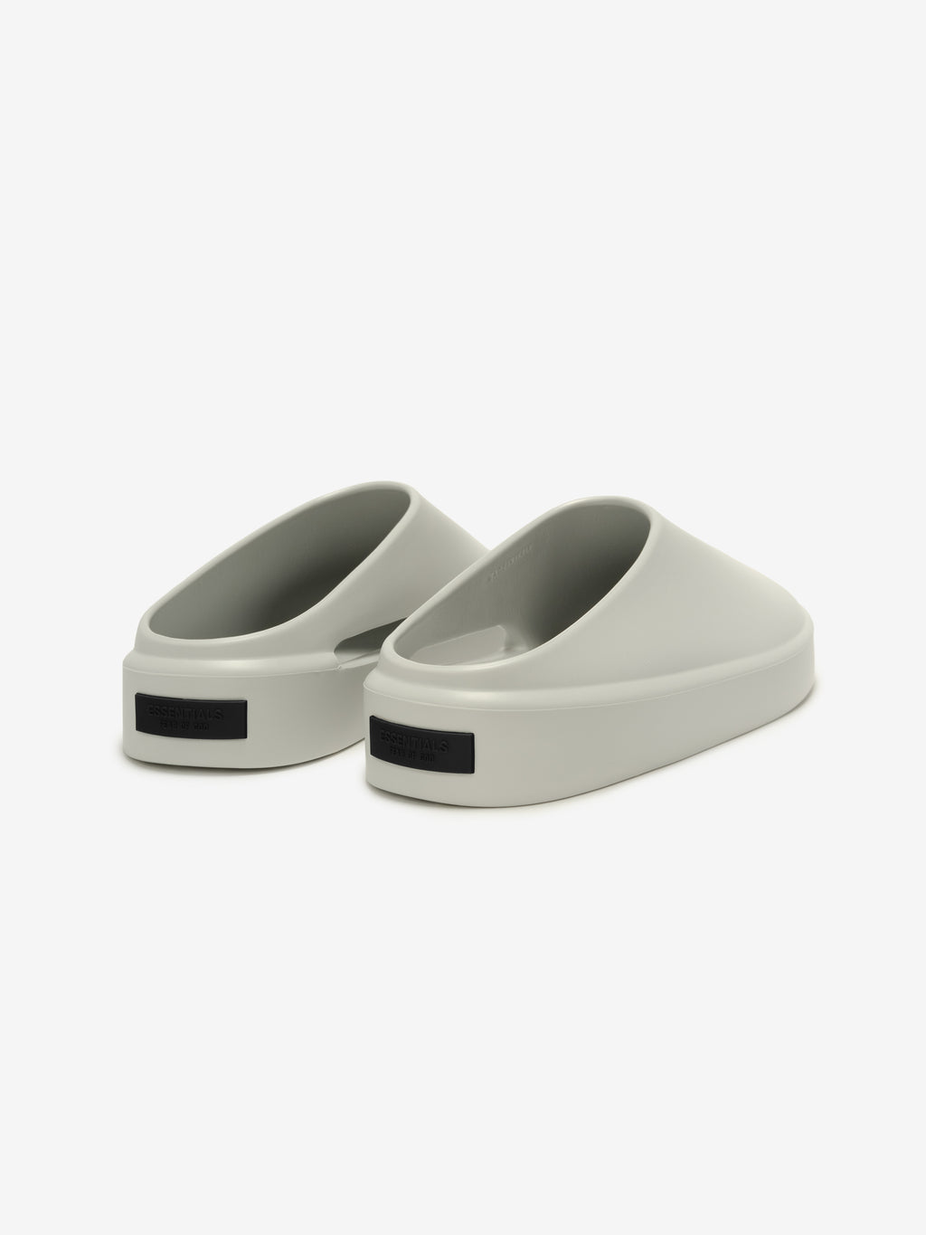 Essentials California 1.0 slip-on footwear in a soft oyster shade, featuring a modern, sculptural silhouette with a minimalist design for effortless casual comfort.