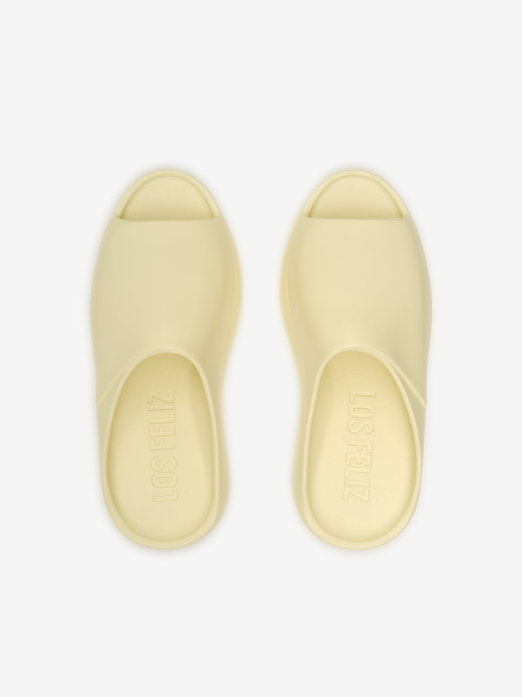 Essentials Los Feliz slip-on footwear in a smooth almond shade featuring a sleek, open-toe design with a contoured footbed for relaxed and modern casual comfort.