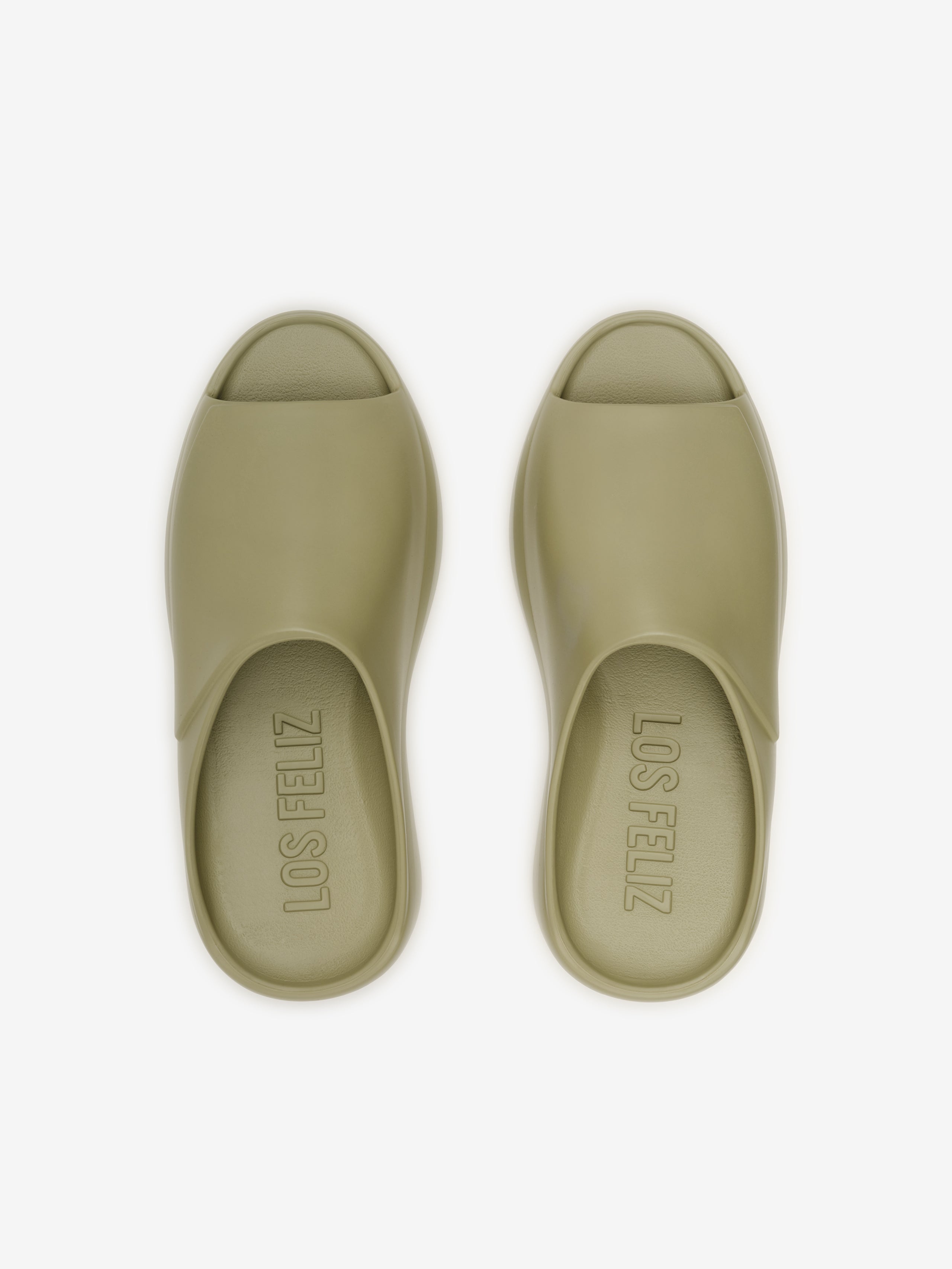 Essentials Los Feliz slip-on footwear in a muted olive shade featuring a smooth, open-toe design with a streamlined upper and a cushioned sole for laid-back casual comfort.