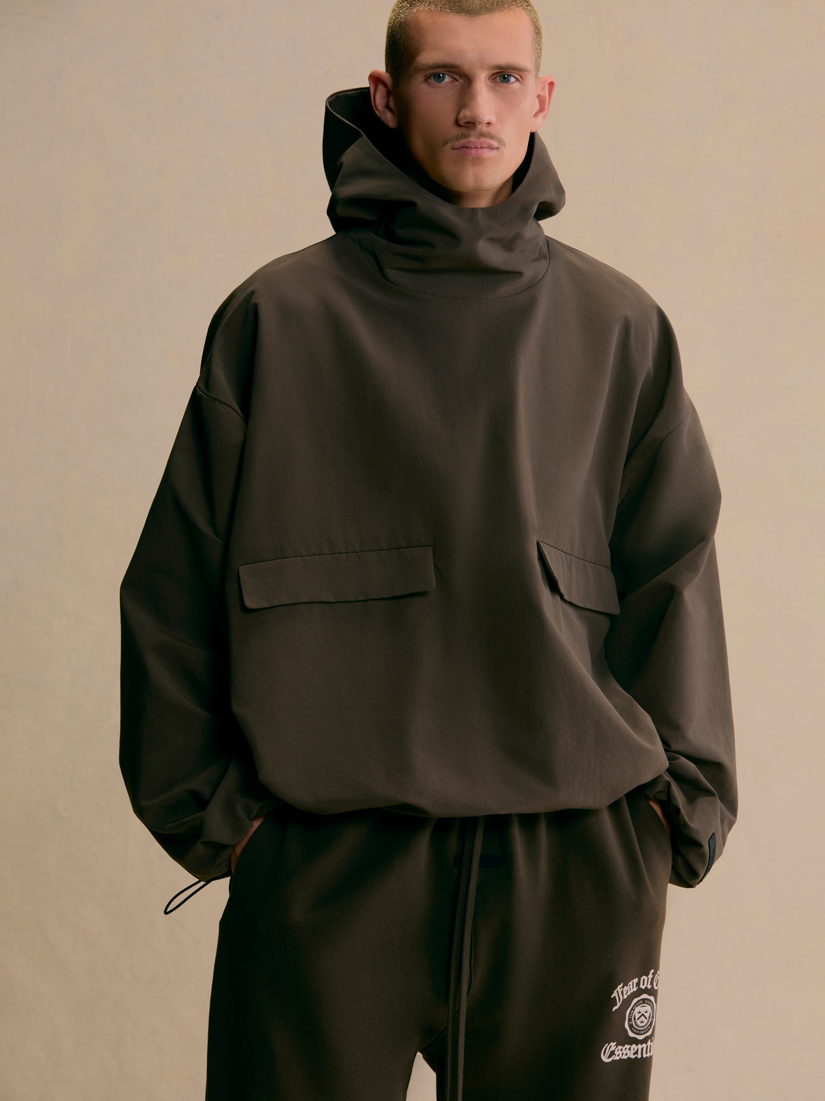Military Nylon Hooded Anorak in Brown | Fear of God ESSENTIALS 