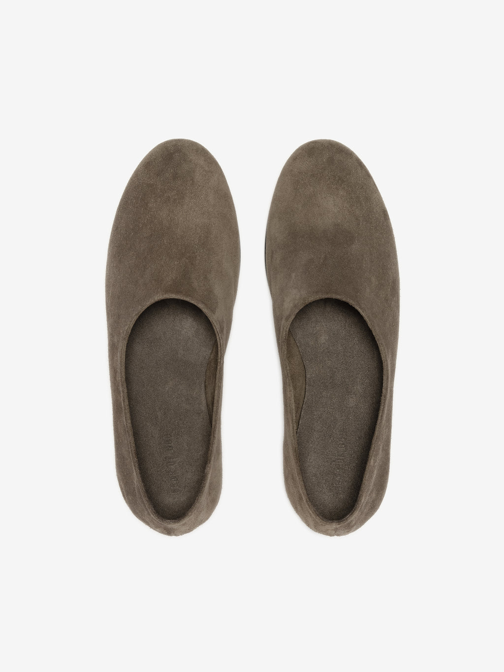 Top view of a pair of soft taupe suede ballet flats with rounded toes on a white background