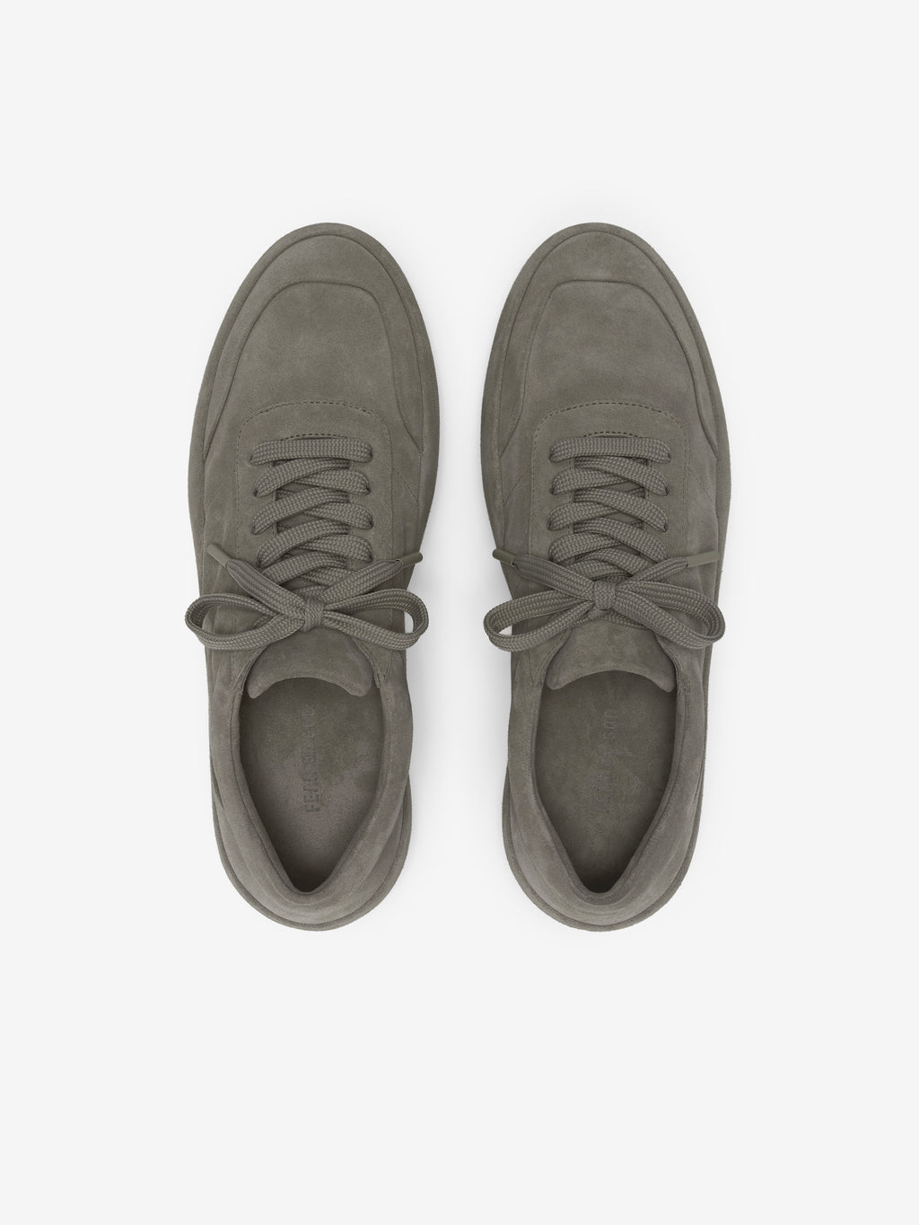 Suede Lace Up Runner in a muted taupe shade featuring a smooth suede upper with tonal stitching, lace-up closure, and a cushioned sole designed for refined casual footwear.
