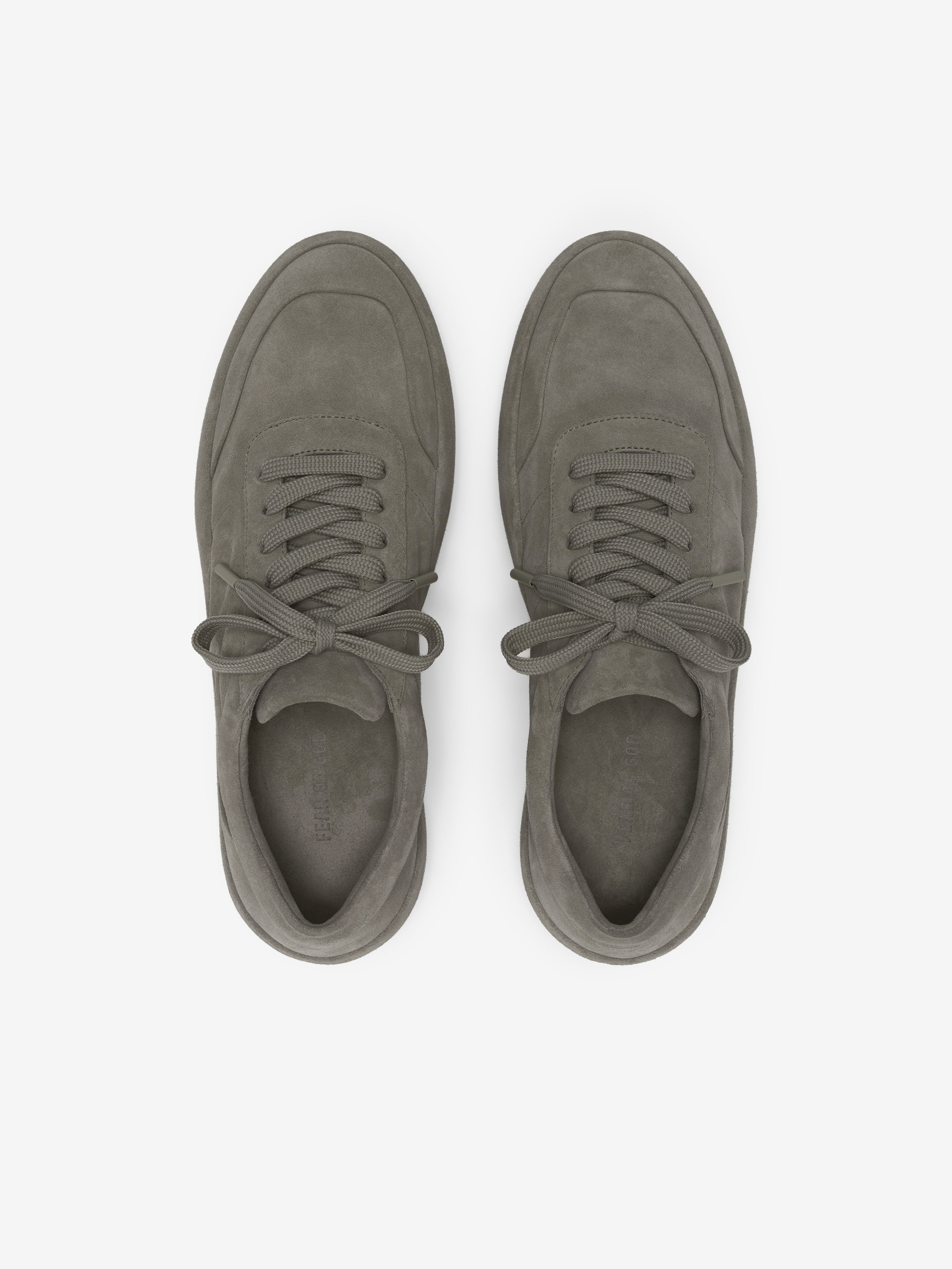 Suede Lace Up Runner in a muted taupe shade featuring a smooth suede upper with tonal stitching, lace-up closure, and a cushioned sole designed for refined casual footwear.