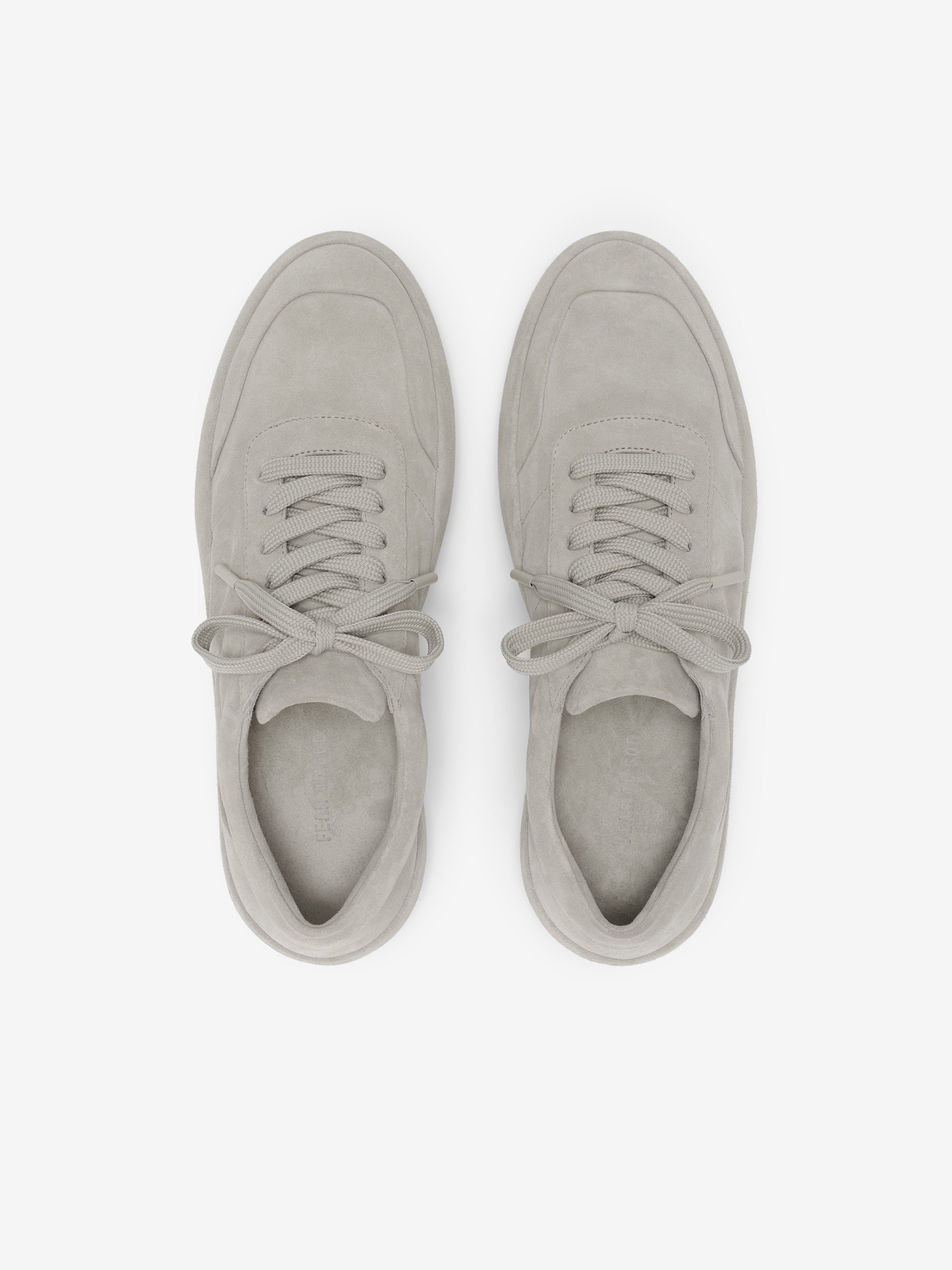 Lace Up Runner in soft light grey suede featuring a clean design with tonal laces, padded tongue, and a minimalist silhouette crafted for everyday footwear comfort.