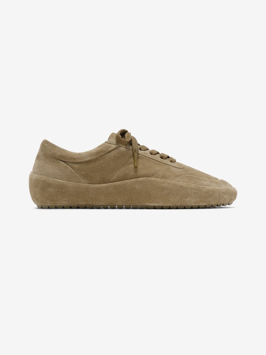 single tan suede low-profile sneaker with molded sole and tonal laces side view on white background