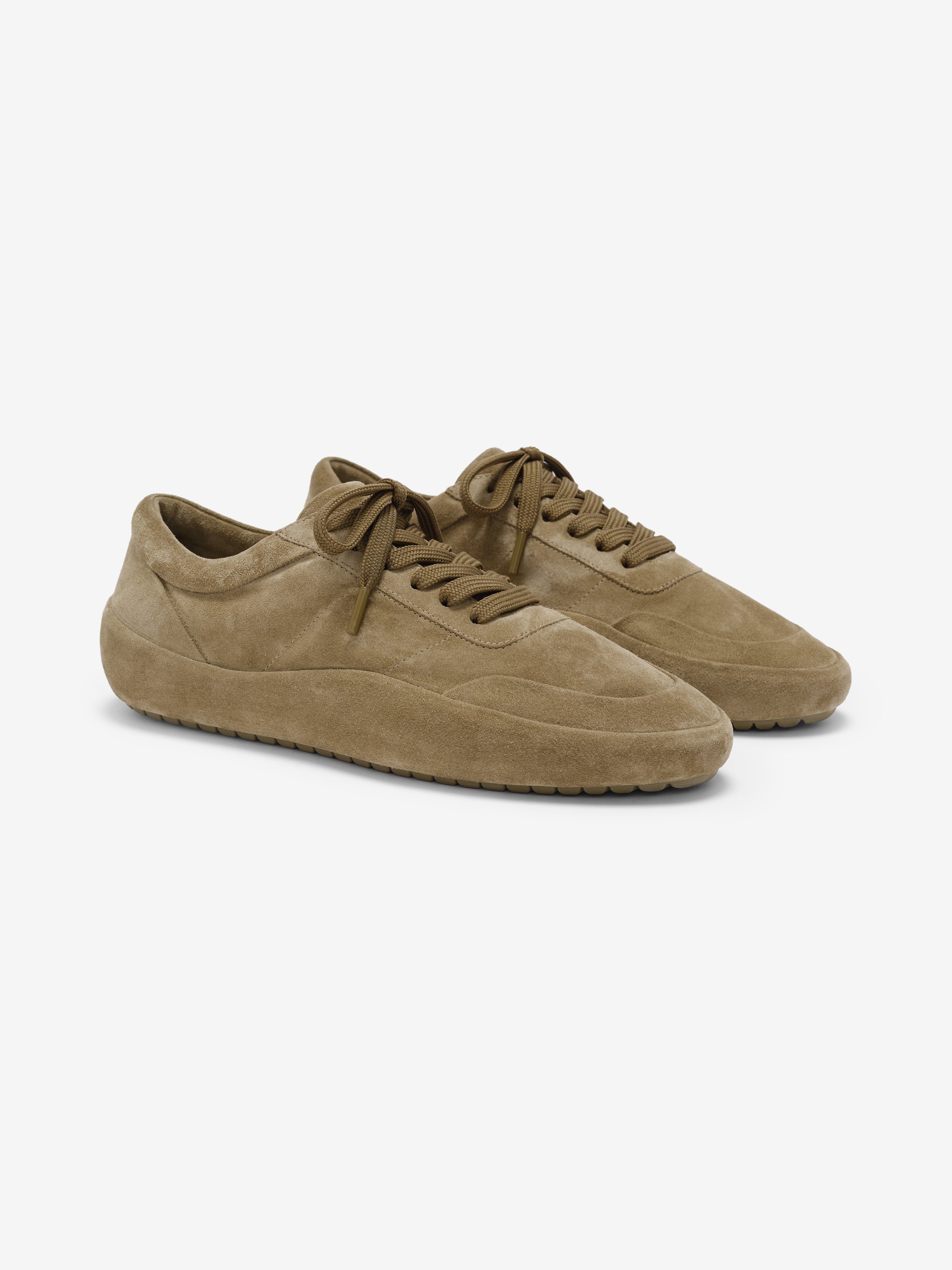 pair of tan suede low-profile Lace Up Runner sneakers with sculpted midsoles and tonal laces angled side view