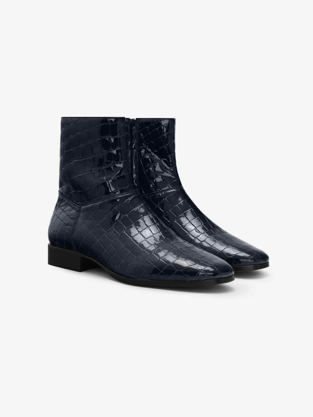 Croc Printed Ankle Boot in a glossy midnight blue featuring a pointed toe, textured croc-embossed design, side zipper closure, and a low block heel for contemporary footwear style.