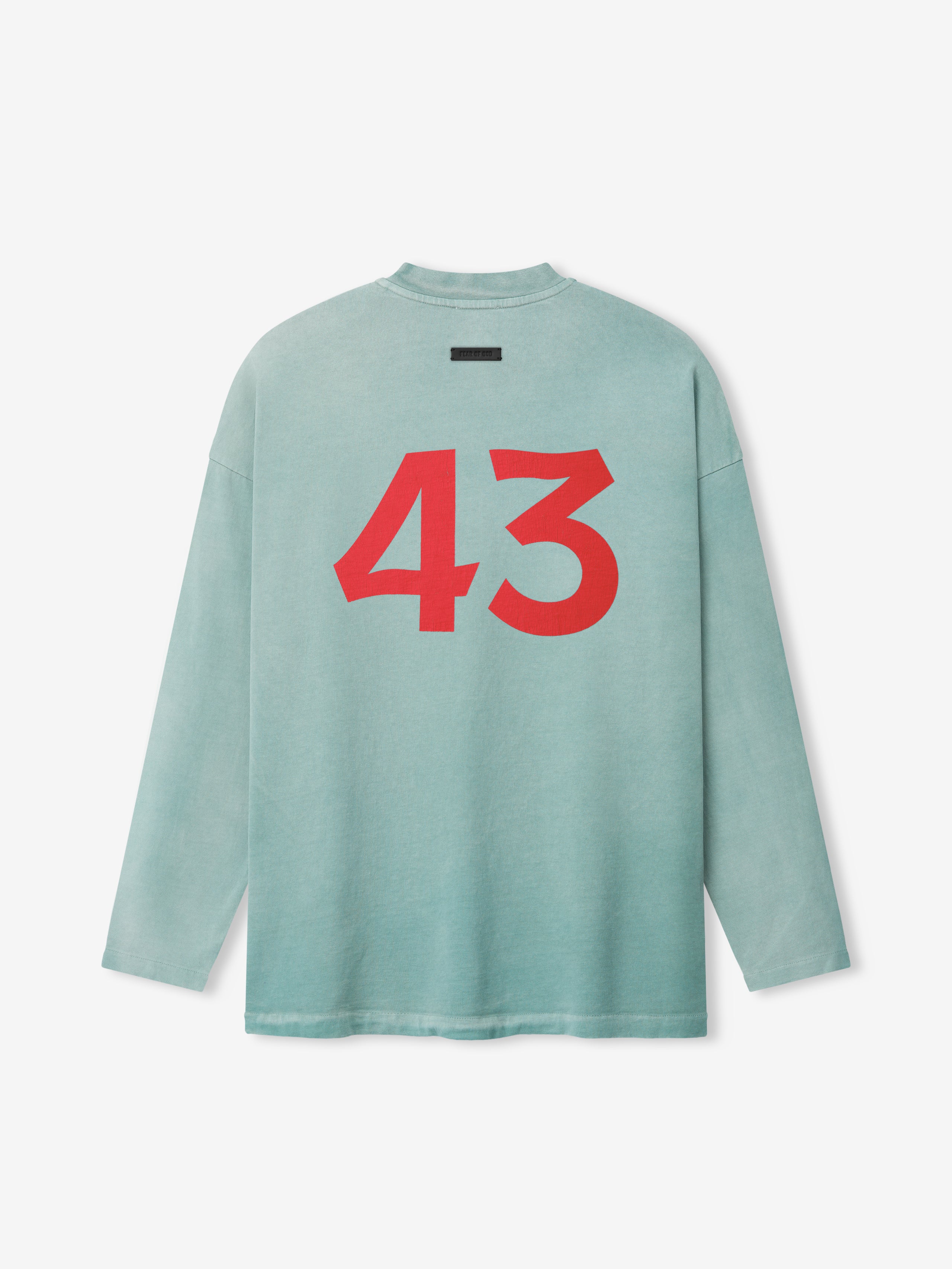 Light blue long-sleeve shirt with large bold red number "43" printed on the back on a plain background