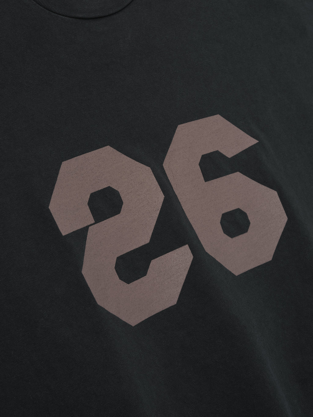 black heavyweight cotton jersey tee with large faded number 26 printed on front in vintage sun-faded style