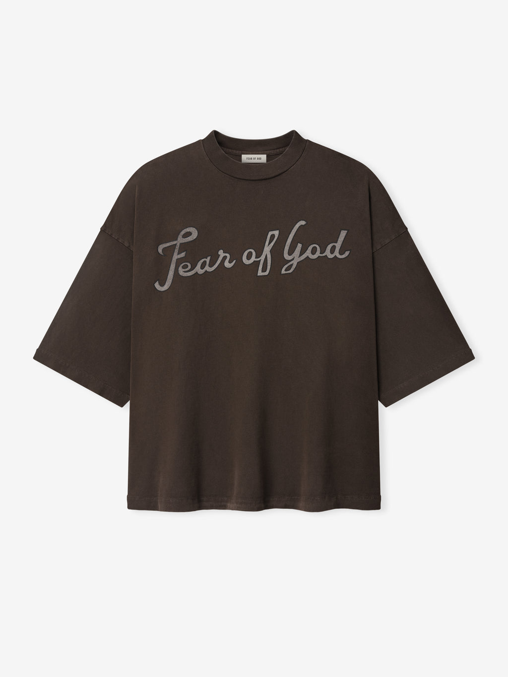 Dark brown oversized T-shirt with "Fear of God" scripted across the chest on a plain white background