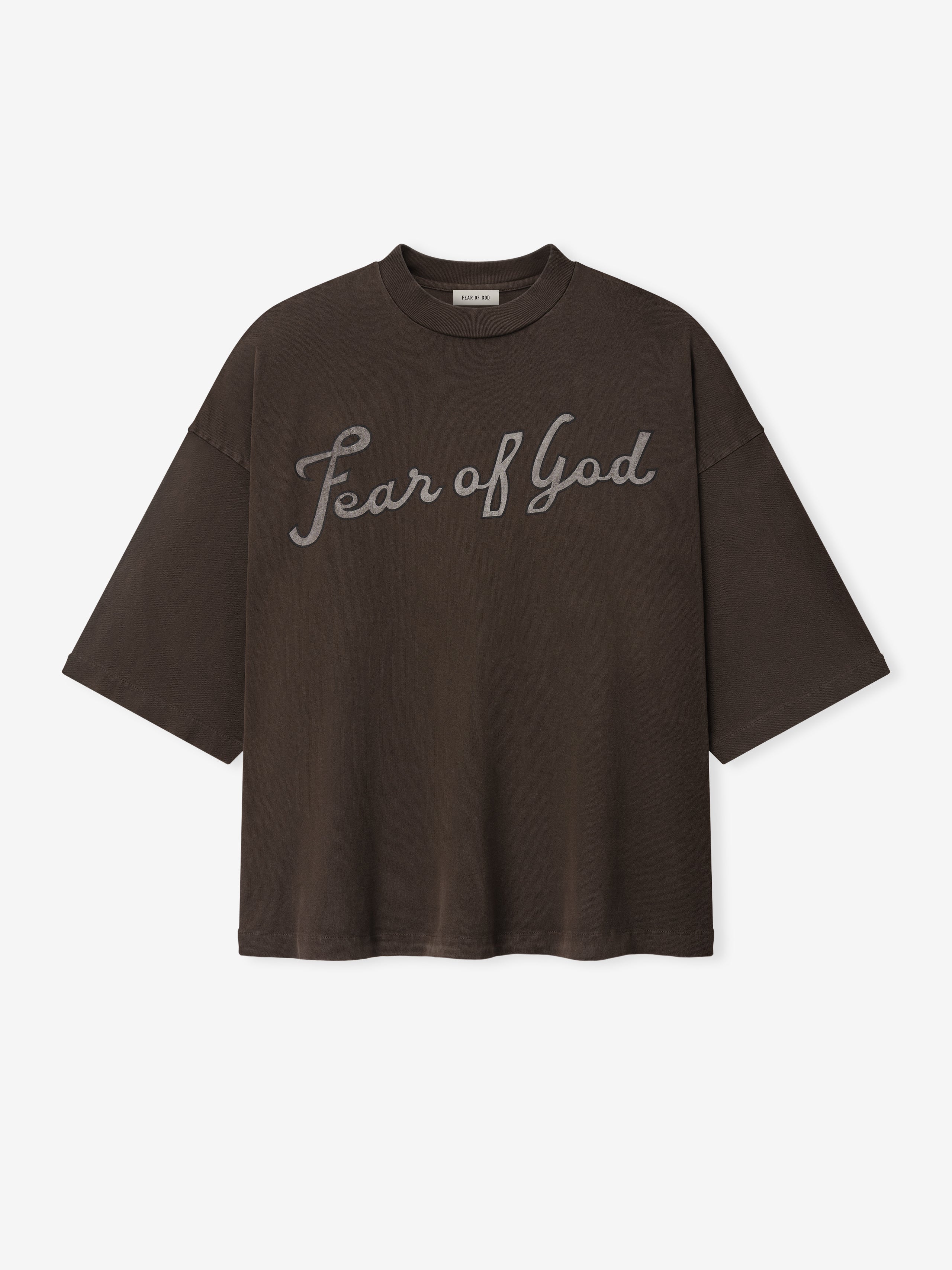Dark brown oversized T-shirt with "Fear of God" scripted across the chest on a plain white background