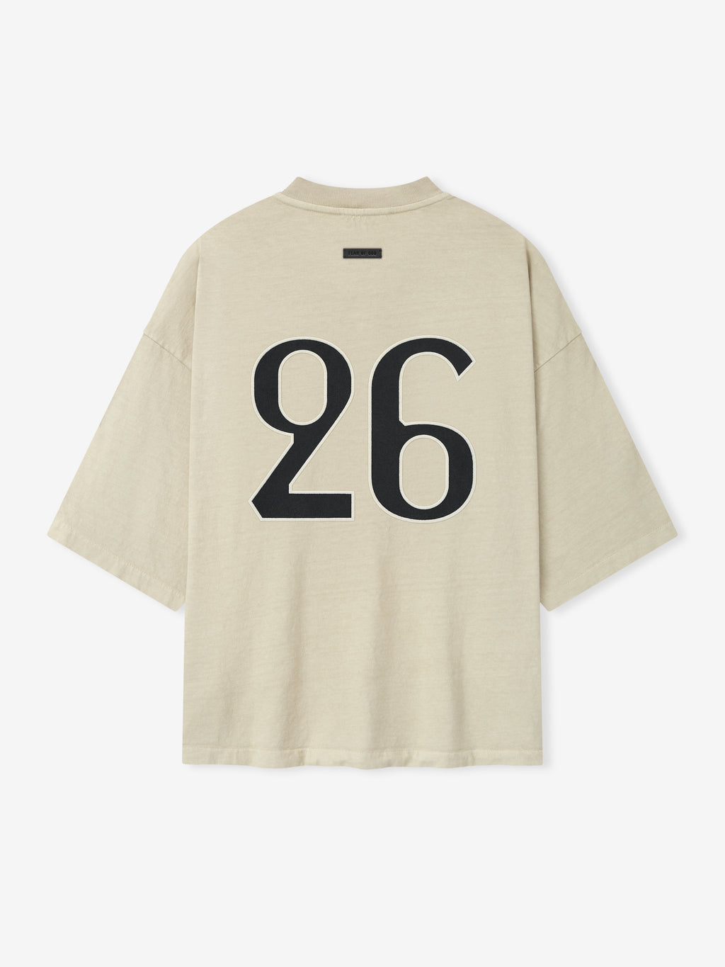 oversized sun-faded beige heavyweight cotton tee with large bold black number 26 printed on back