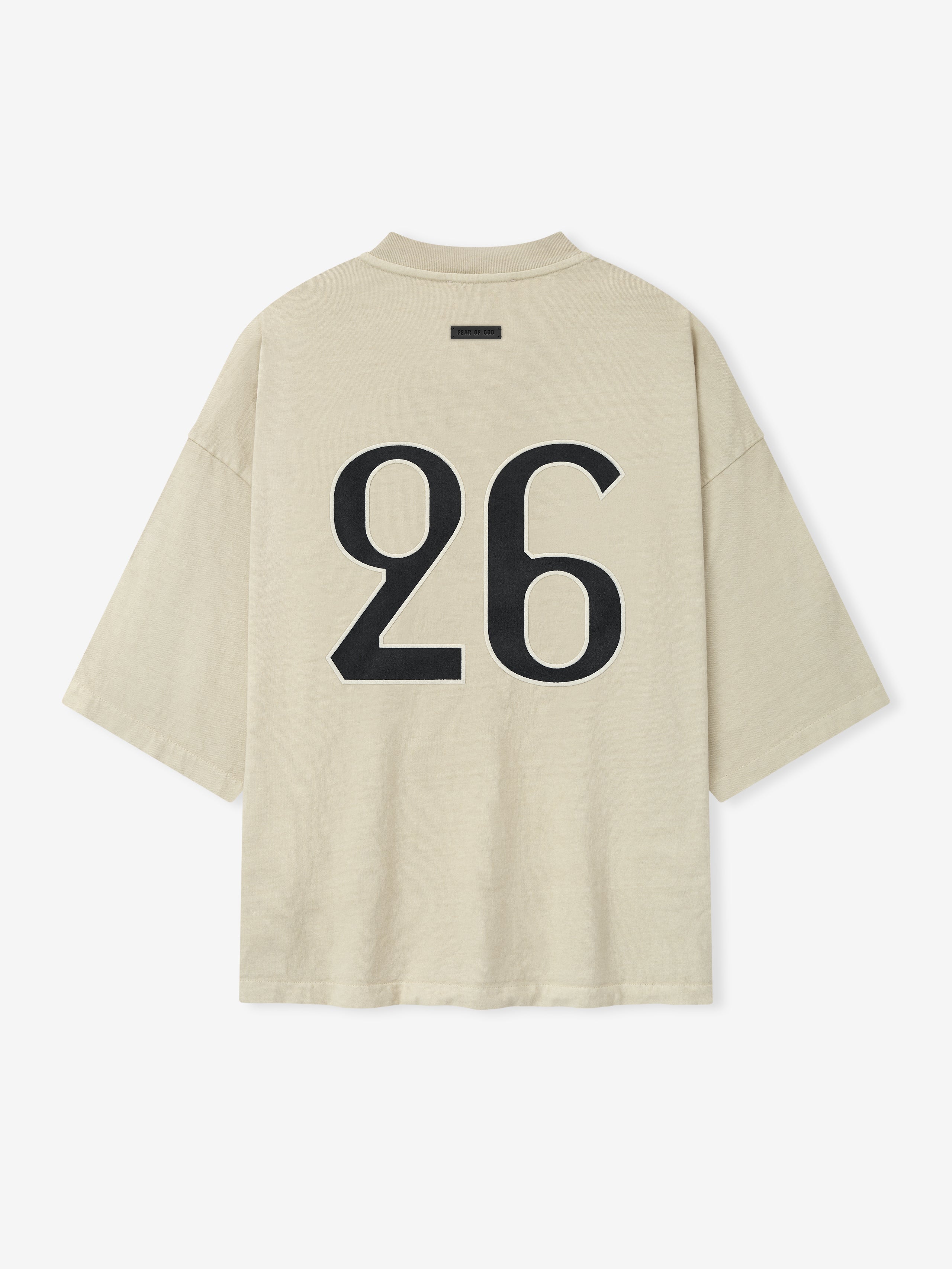oversized sun-faded beige heavyweight cotton tee with large bold black number 26 printed on back
