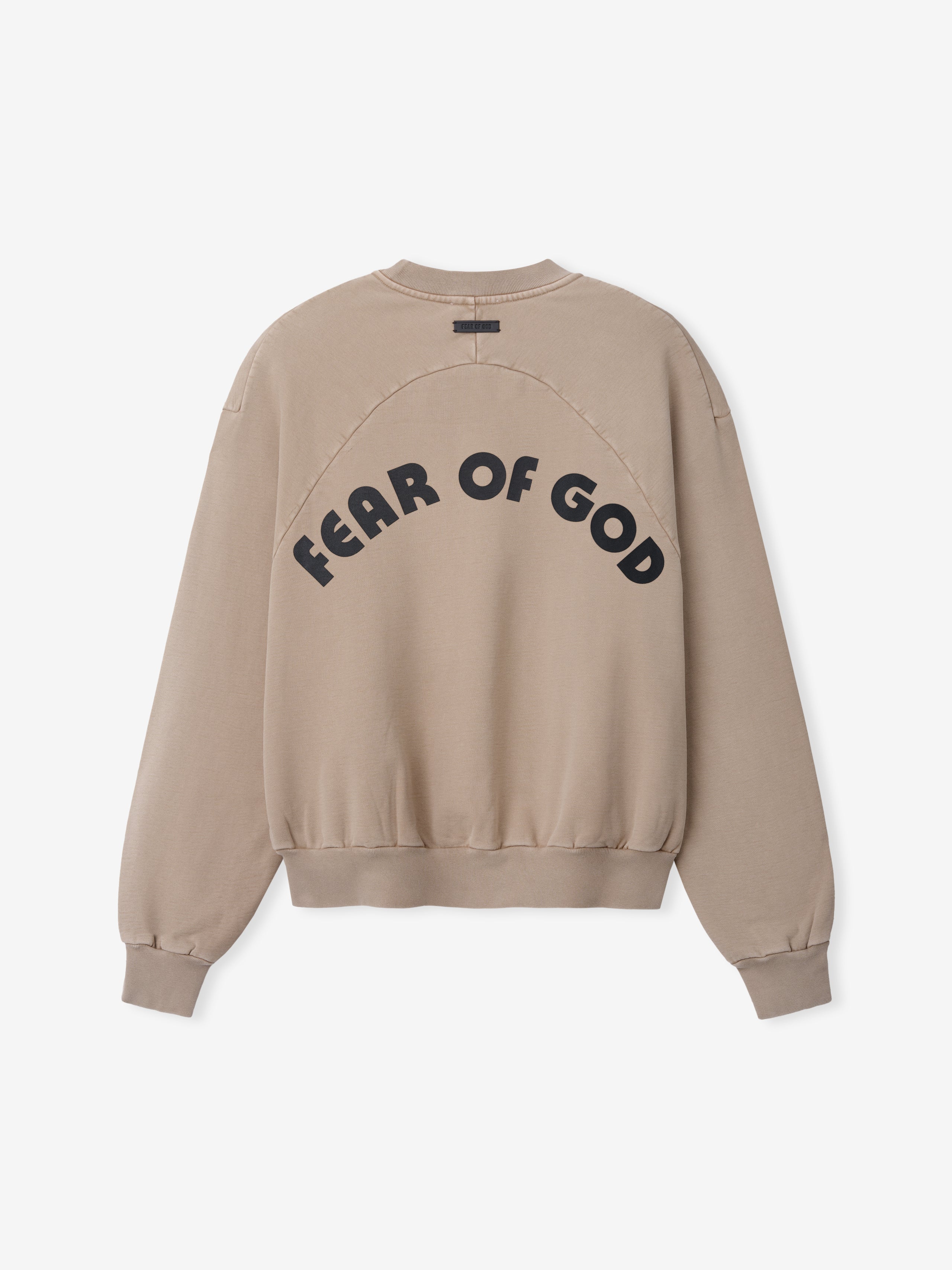 Back view of dune-colored sweatshirt with bold black "FEAR OF GOD" text in arched layout and ribbed cuffs and hem