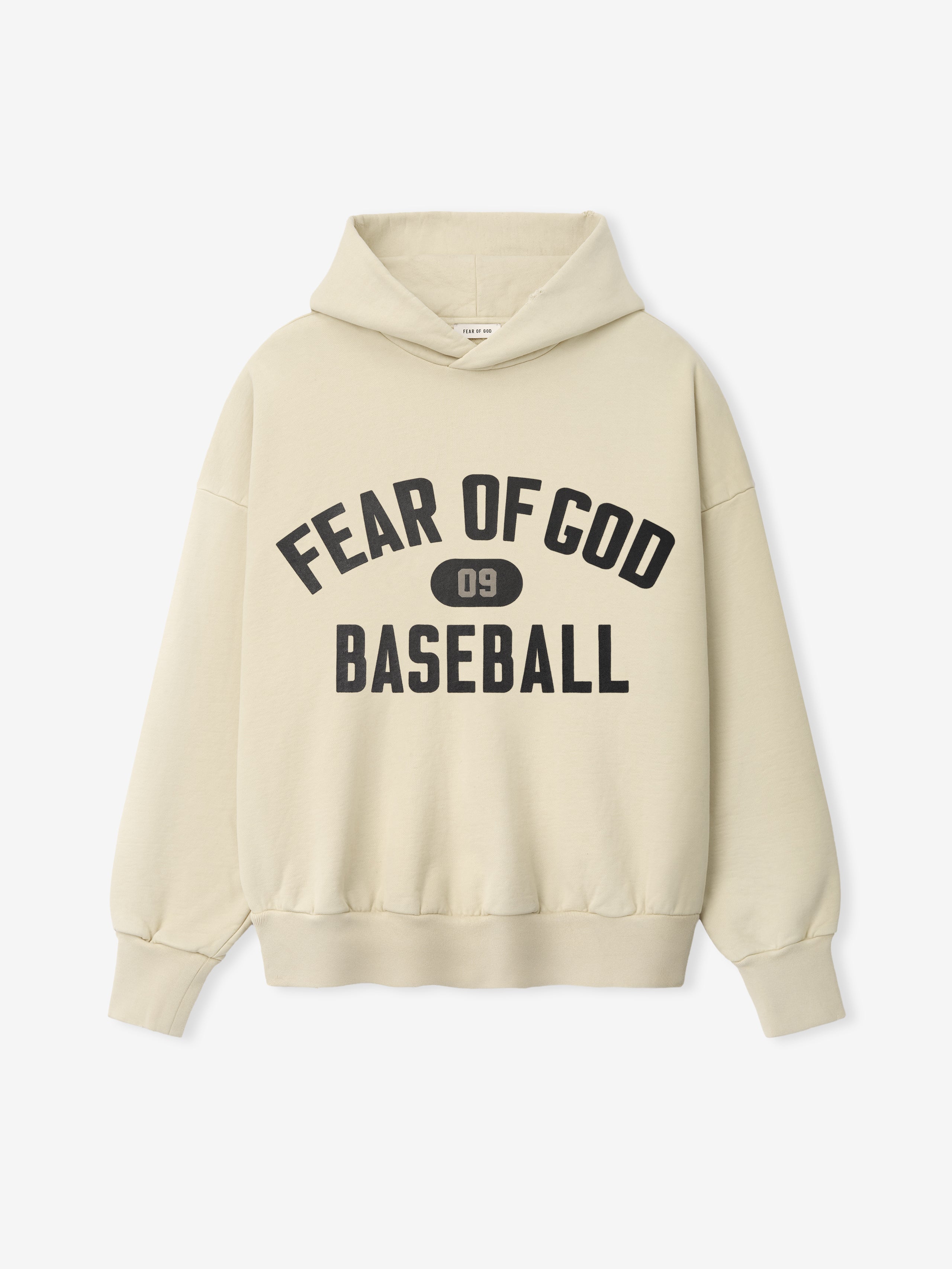 Front view of a dirty ivory hoodie with large black text "Fear of God Baseball" and "09" emblem on the chest
