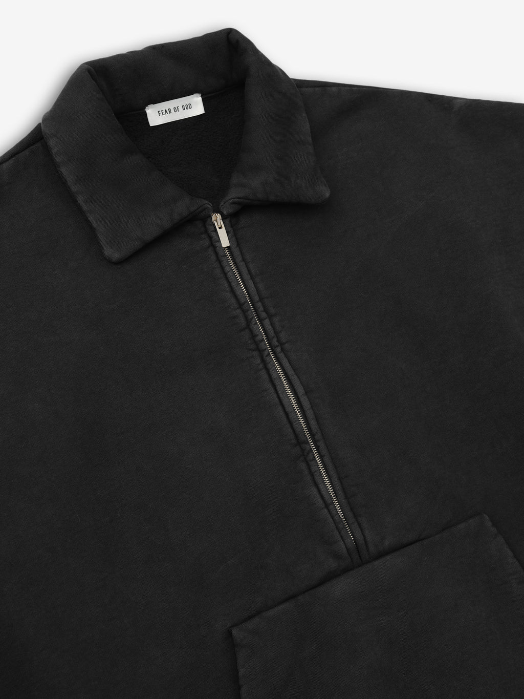 close-up of vintage faded black cotton fleece half zip polo sweatshirt with collar and zip detailing