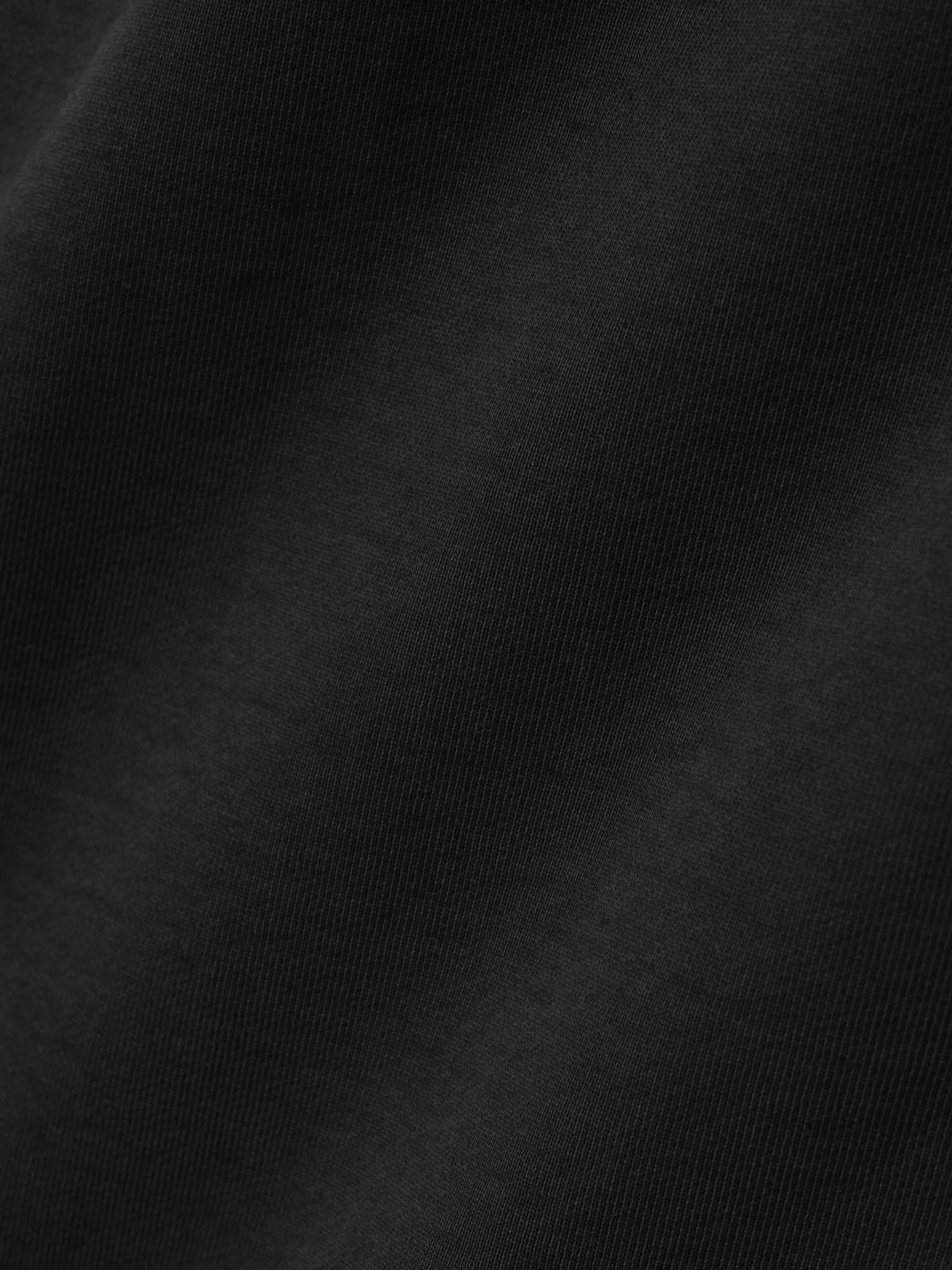 close-up of black heavyweight cotton fleece fabric with a soft texture from FG Classic Sweatpant garment wash