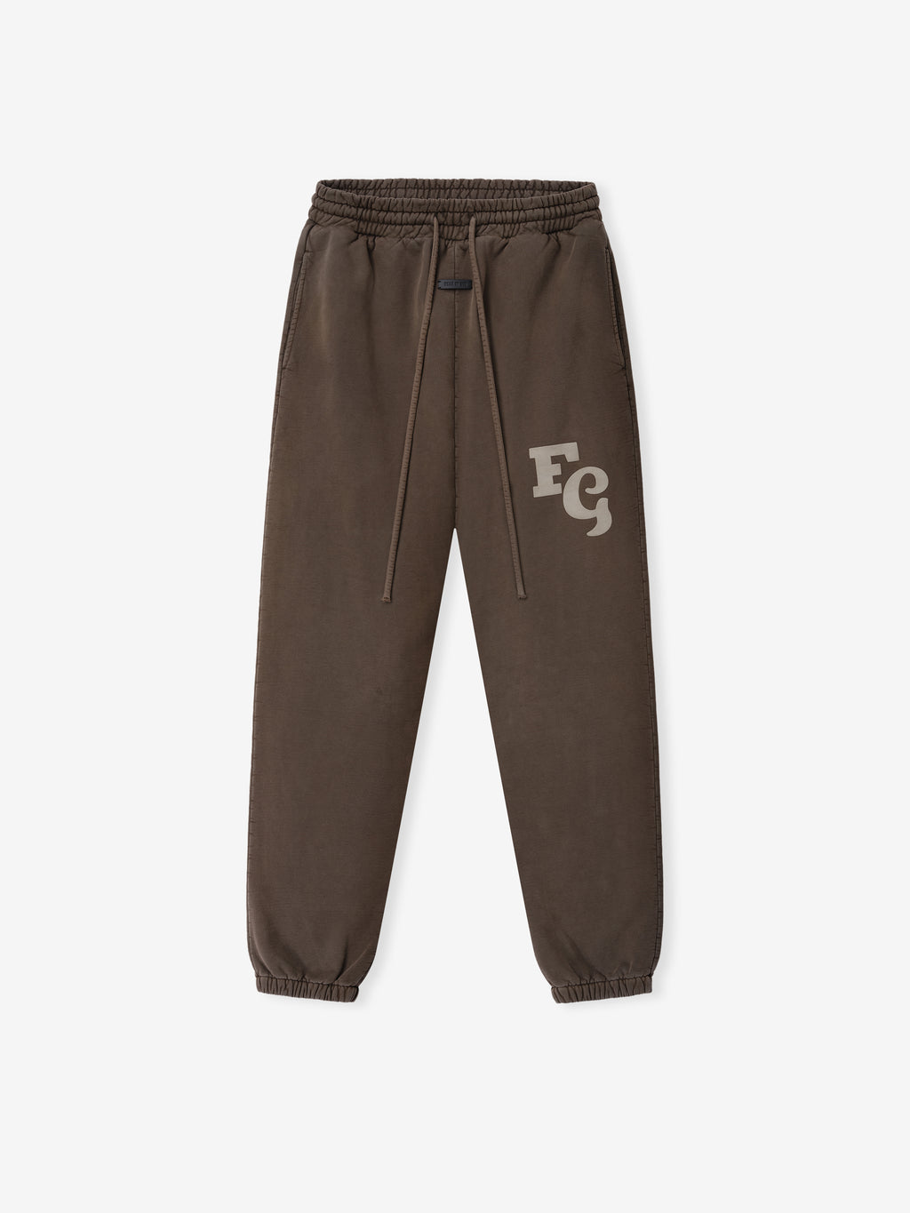 Brown faded sweatpants with elastic waistband, drawstrings, side pockets, and light logo print on left thigh