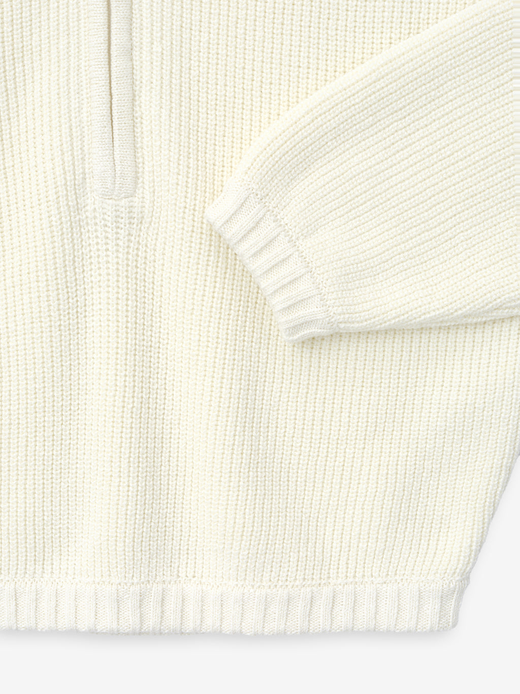 close-up of off-white half-zip sweater in double-knit linen-wool-cotton blend with ribbed cuffs and hem