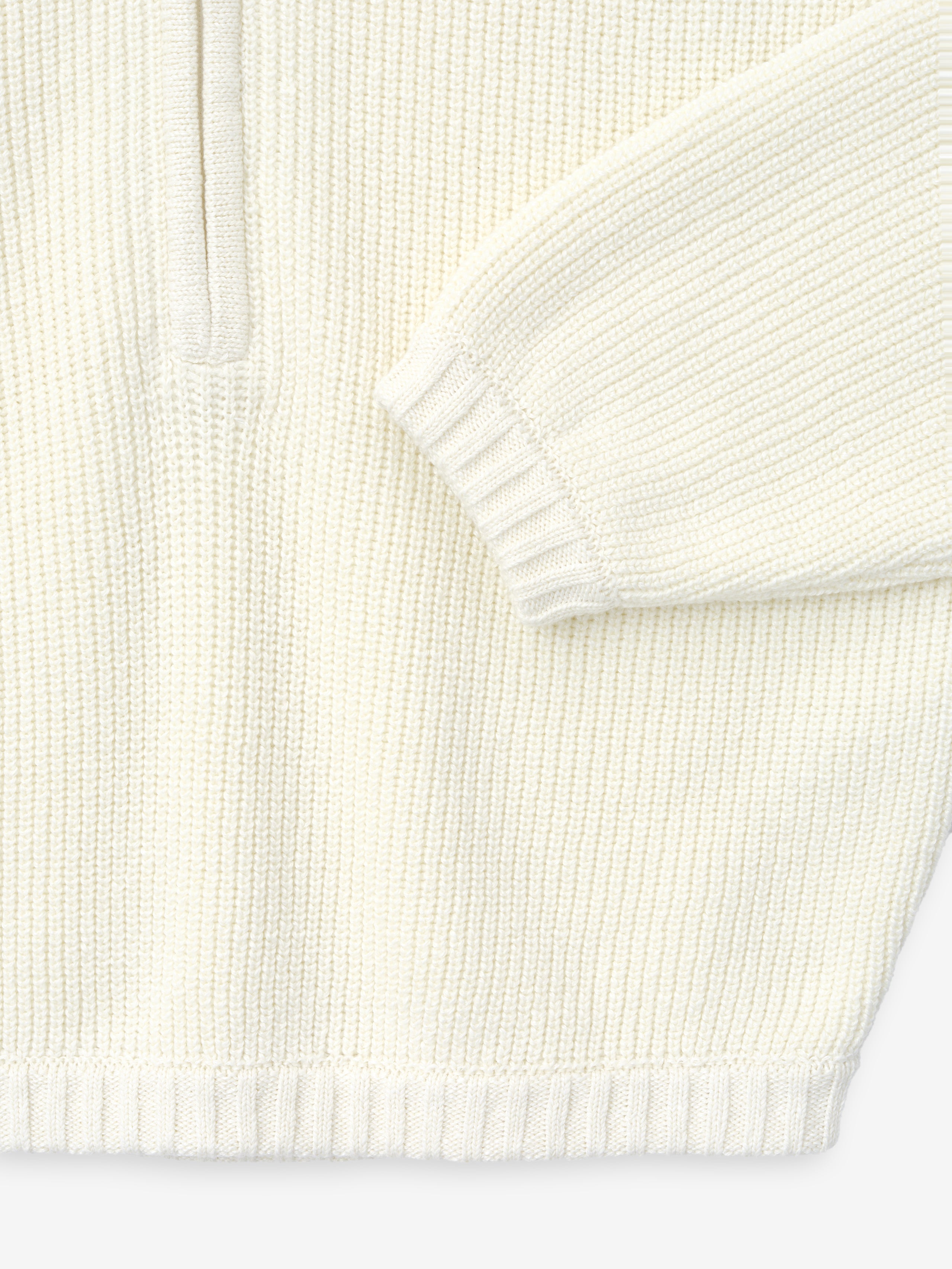 close-up of off-white half-zip sweater in double-knit linen-wool-cotton blend with ribbed cuffs and hem