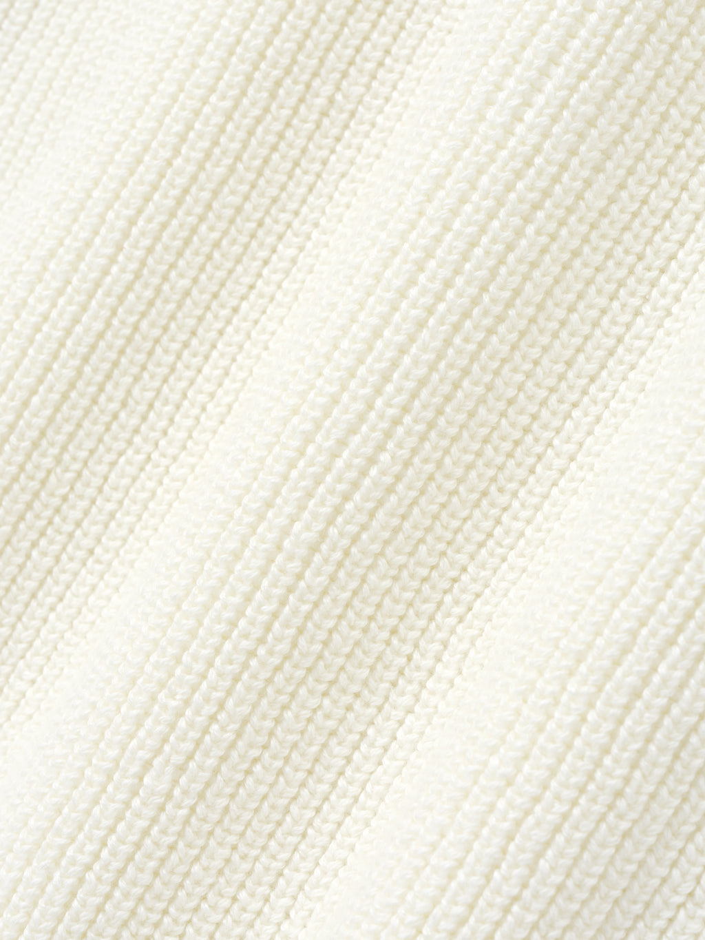 close-up detail of textured off-white double-knit linen-wool-cotton fabric with fine ribbed pattern